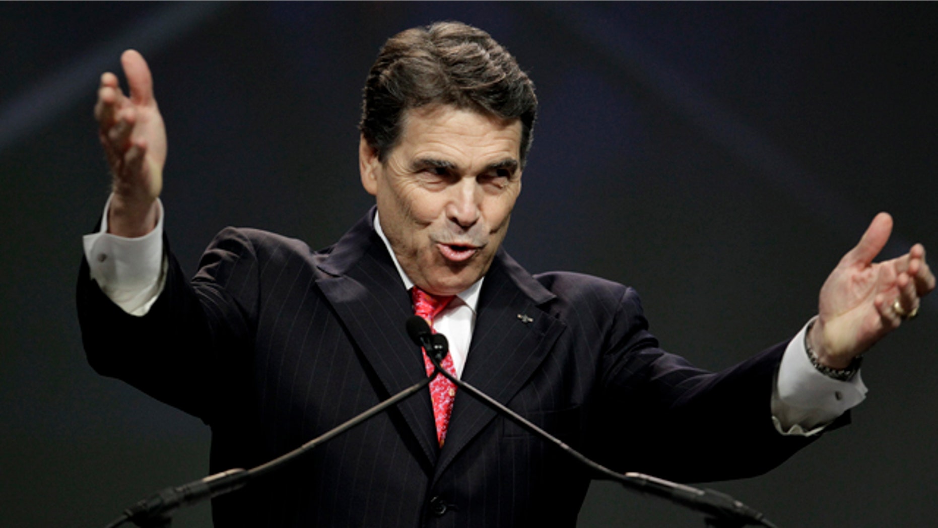 Gov. Rick Perry speaks earlier this month at a call to prayer for a nation in crisis.