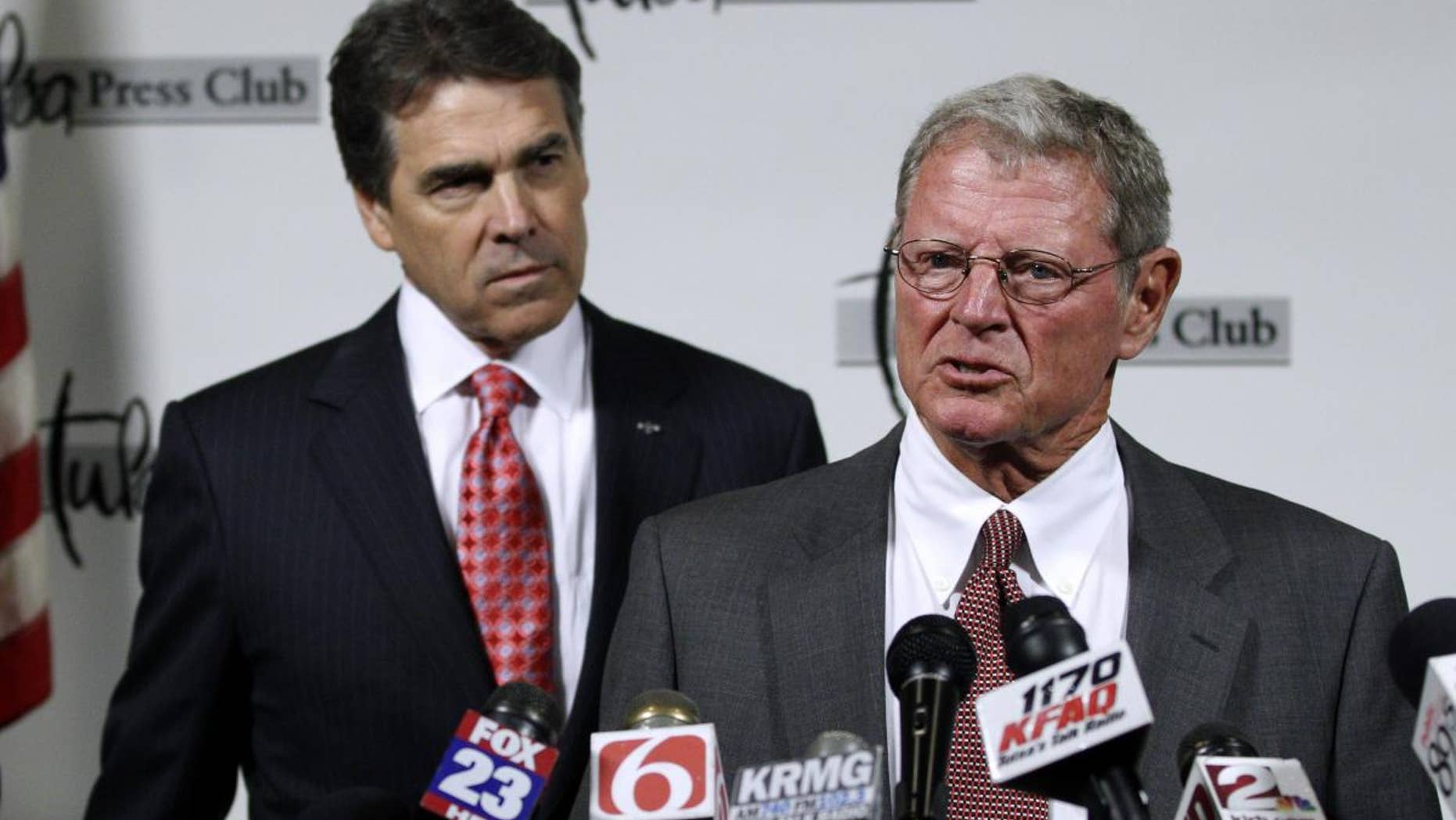 Sen. Jim Inhofe, R-Okla., right, introduces Republican presidential candidate, Texas Gov. Rick Perry, at a news conference in Tulsa, Okla., Monday, Aug. 29, 2011. (AP Photo/Sue Ogrocki)