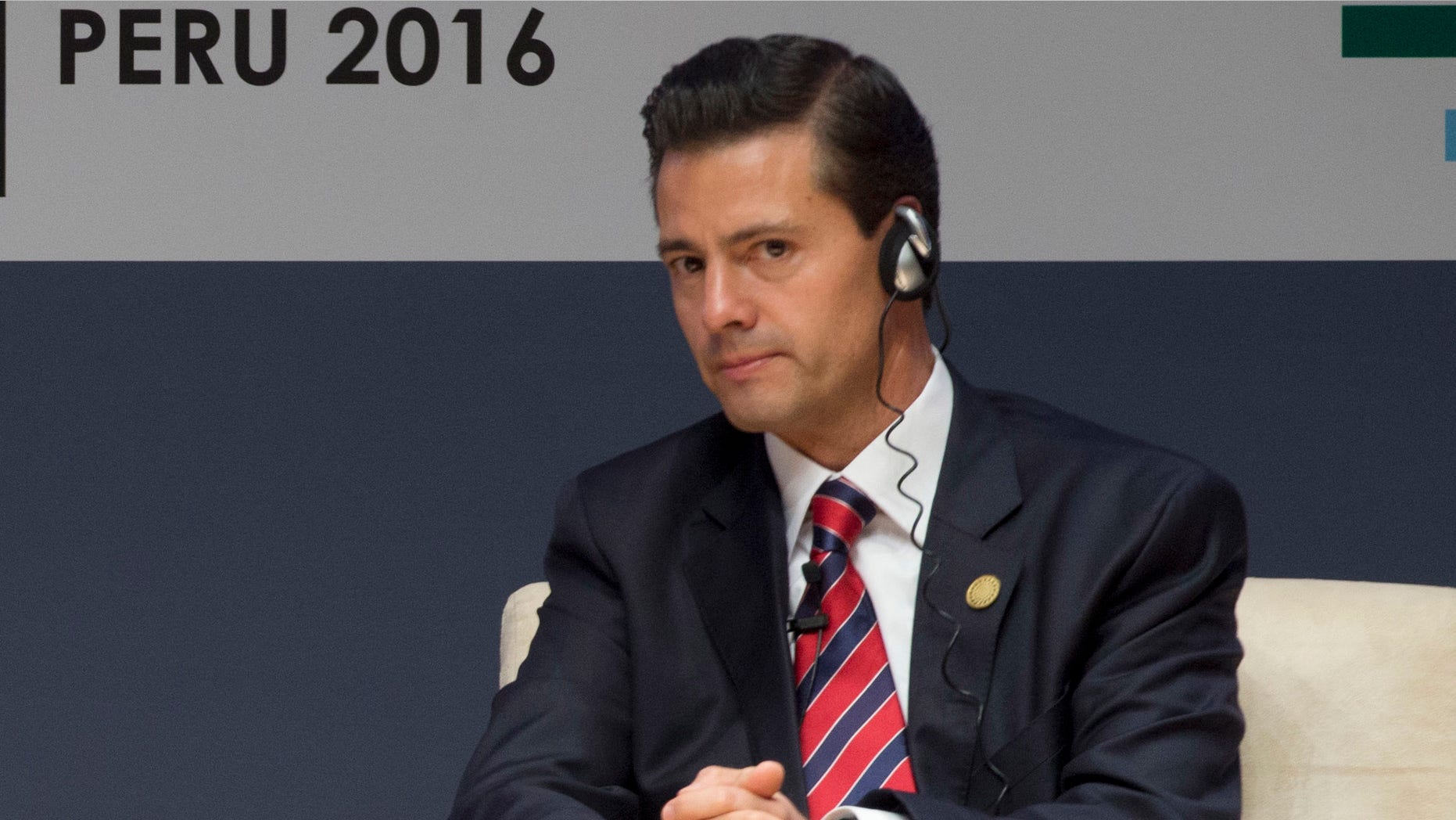 New Zealand's Prime Minister John Key, left, and Mexico's President Enrique Pena Nieto, patucipate in a forum about trade at the Asia Pacific Economic Cooperation, APEC, CEO Summit, in Lima, Peru, Saturday, Nov. 19, 2016. (AP Photo/Esteban Felix)