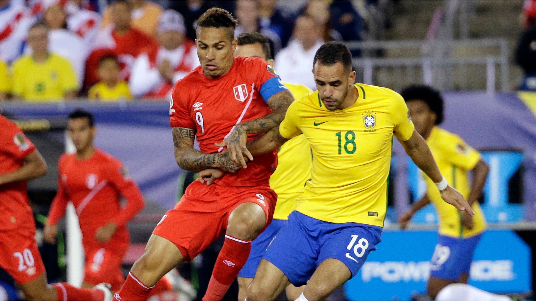Peru's Paolo Guerrero and Brazil's Renato Augusto on Sunday, June 12, 2016, in Foxborough, Mass.