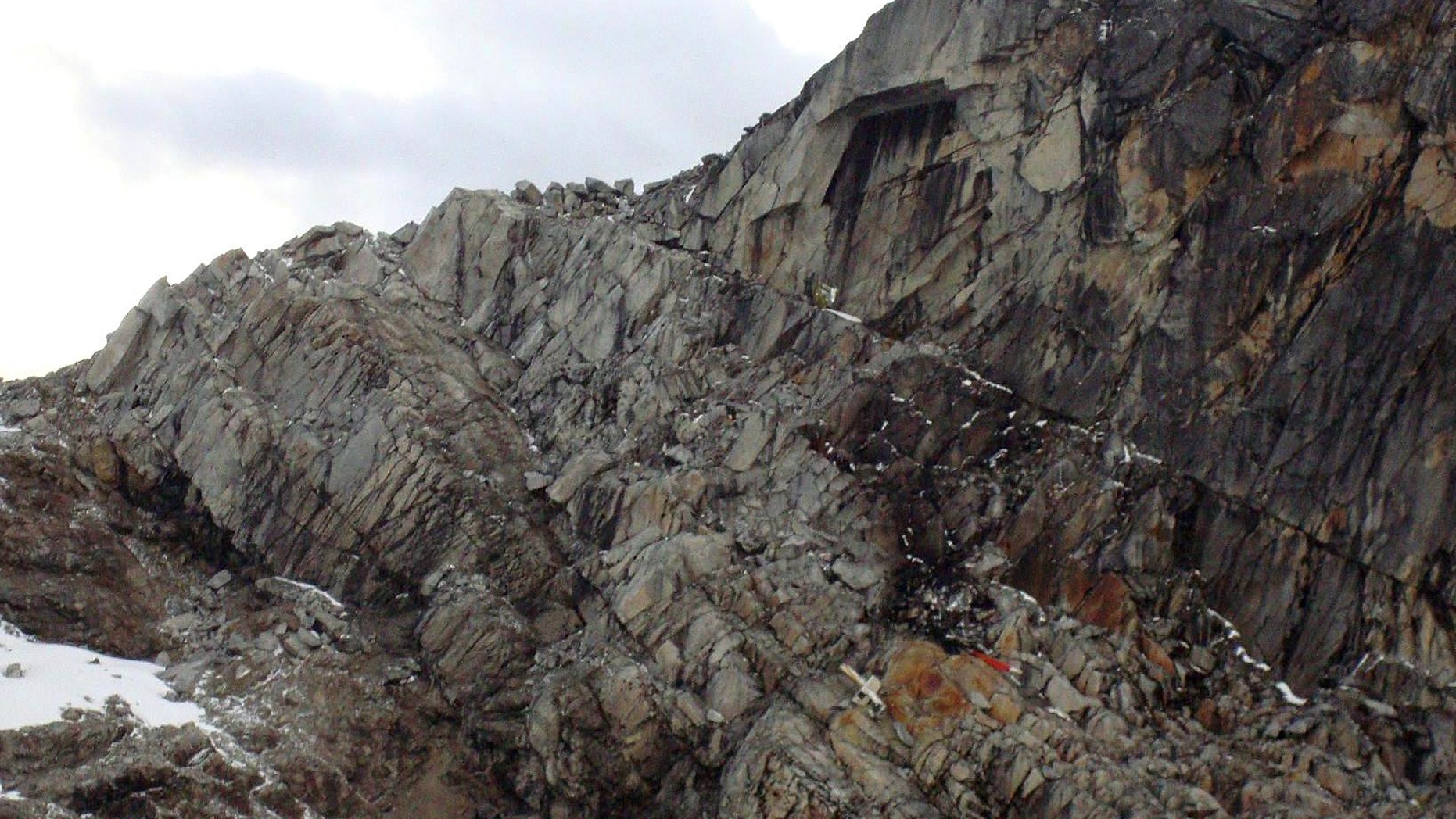 June 9, 2012: On a rocky mountain lays what officials say is debris from the wreckage of a helicopter in the department of Cuzco, Peru.