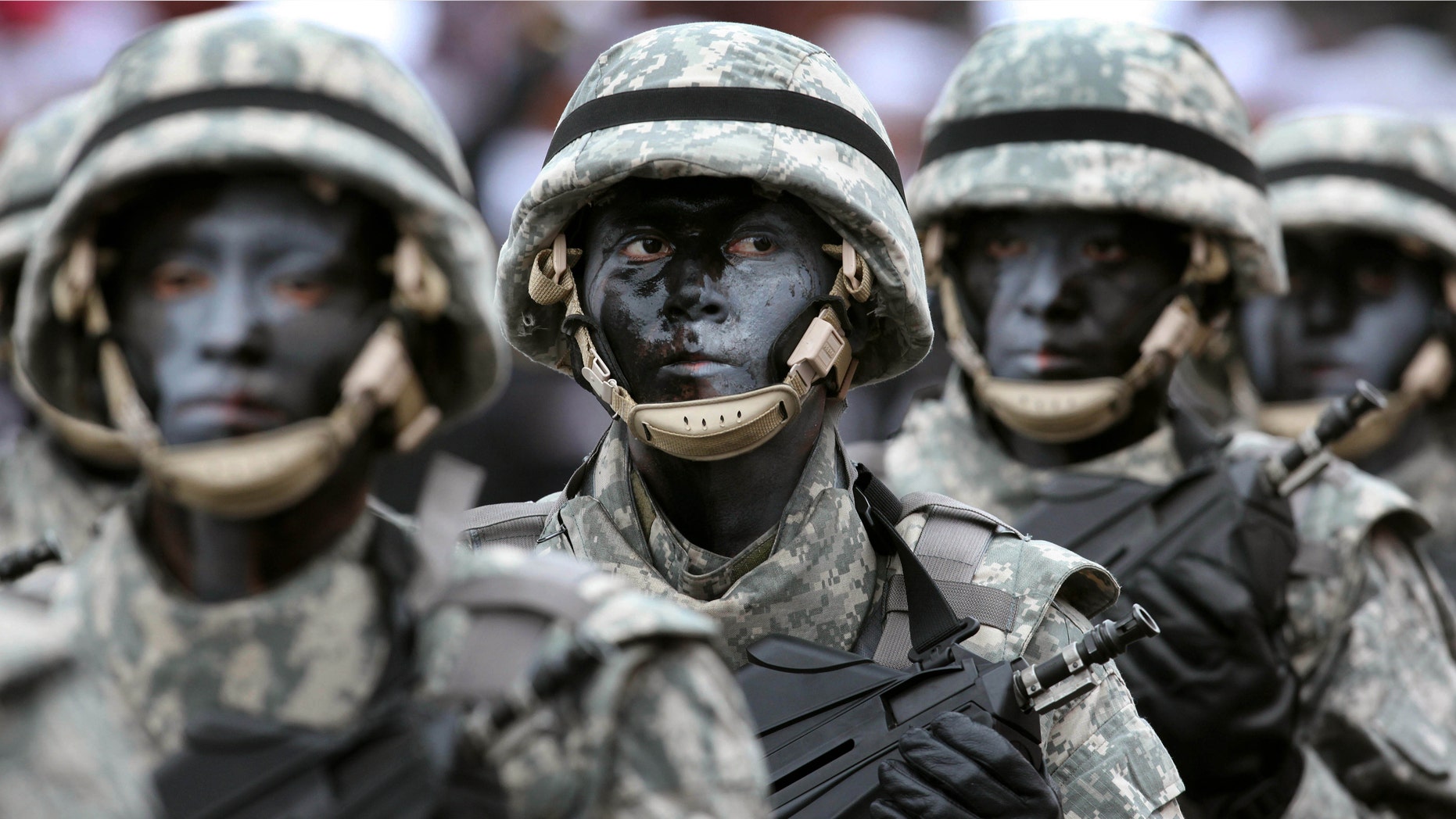 FILE - In this July 29, 2012 file photo, soldiers march during a military parade marking Peru's Independence Day in Lima, Peru. Facing a shortage of recruits, Peru's government has reinstated obligatory military service. But it can be avoided by paying a $700 fine, prompting accusations that what is really being imposed is a draft for the poor. (AP Photo/Karel Navarro, File)