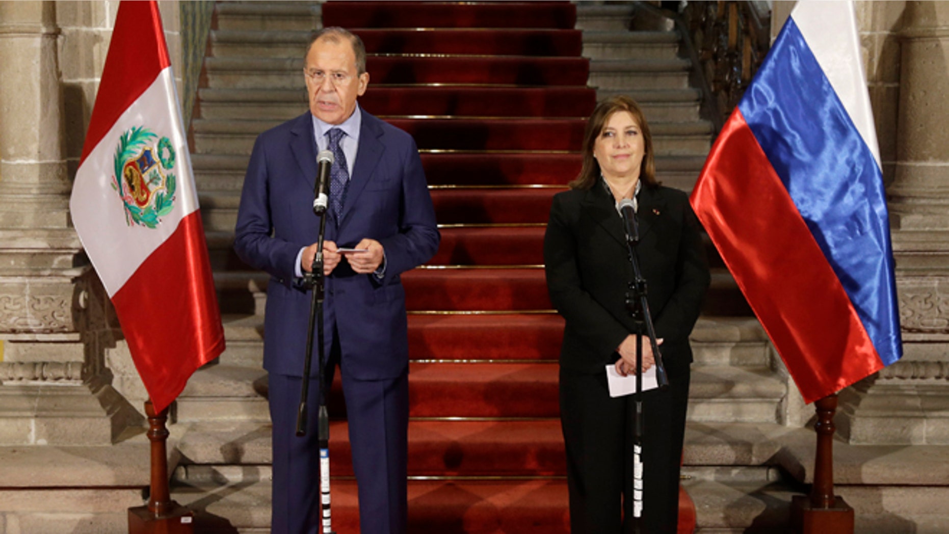 Russian's Foreign Minister Sergey Lavrov, talks during a joint press conference, next to Peru's Foreign Minister Eda Rivas at the Foreign Ministry building in Lima, Peru, Wednesday, April 30, 2014. Lavrov is Lima, for a visit of one day in his tour of Latin America. (AP Photo/Martin Mejia)