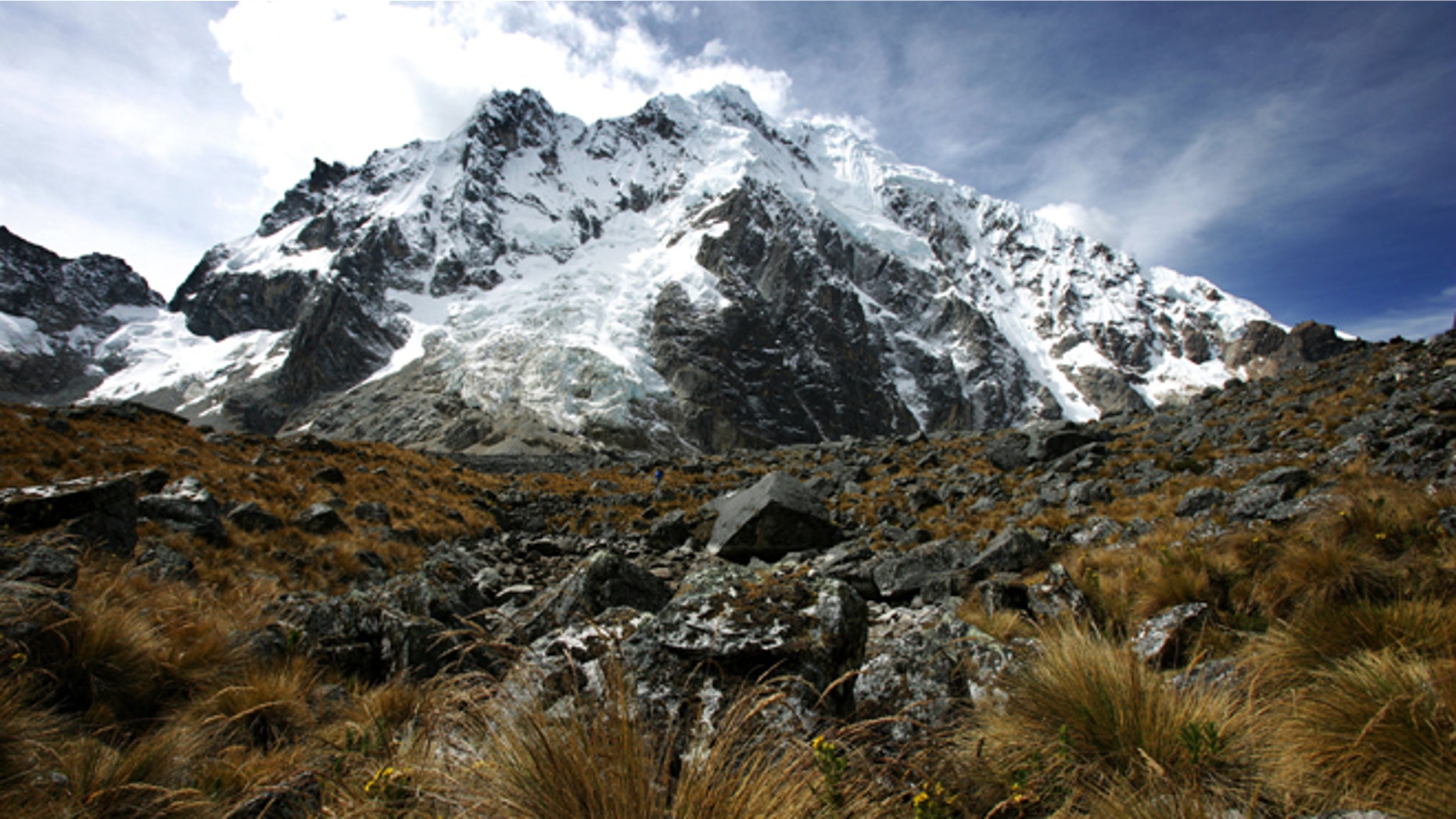 SORAYPAMPA, PERU - JUNE 2007: The trek continues over its highest pass called Salcantayccasa, 4650 meters high, Soraypampa, Peru, 27 June 2007. The pass is a series of steep right angle ascents on the mountain and saw heavy traffic from many European and Israeli hikers. An Israeli girl stopped at the top to play a breathless harmonica recital. The top of the pass is a breath-taking view with many cairns in the area which the locals have placed there for safe passage. The pass winds down into a wide valley with high mountains all around and a river running through the middle. This hidden valley is called Wayraccmachay and is located at 3800 meters. (photo by Brent Stirton/Getty Images.)
