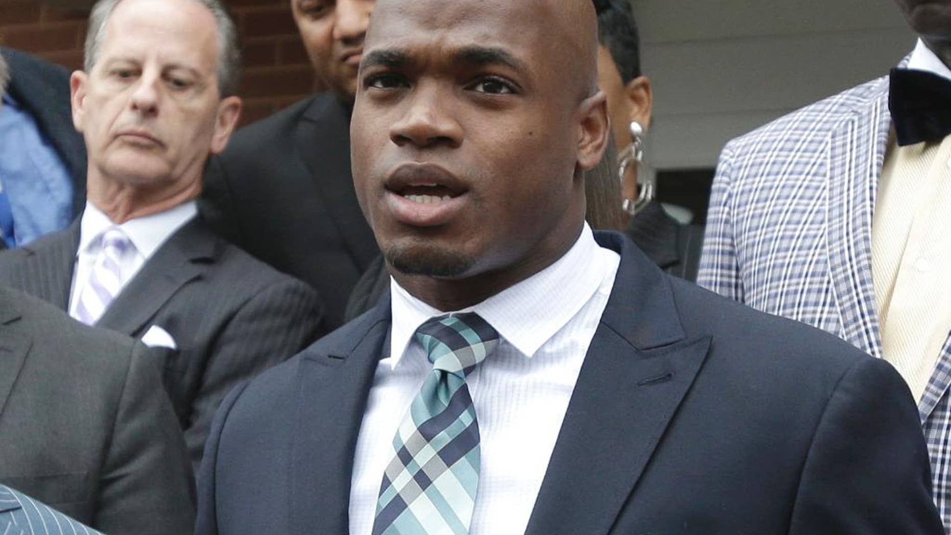 FILE - In this Nov. 4, 2014, file photo, Minnesota Vikings running back Adrian Peterson speaks to the media after pleading no contest to an assault charge in Conroe, Texas. Peterson will meet with the NFL on Monday, Nov. 17, 2014, about possible reinstatement with the Vikings. A person with knowledge of the hearing told The Associated Press on Thursday, Nov. 13, that the hearing will be at 2 p.m. EST. The person spoke on condition of anonymity because the hearing has not been announced. (AP Photo/Pat Sullivan, File)
