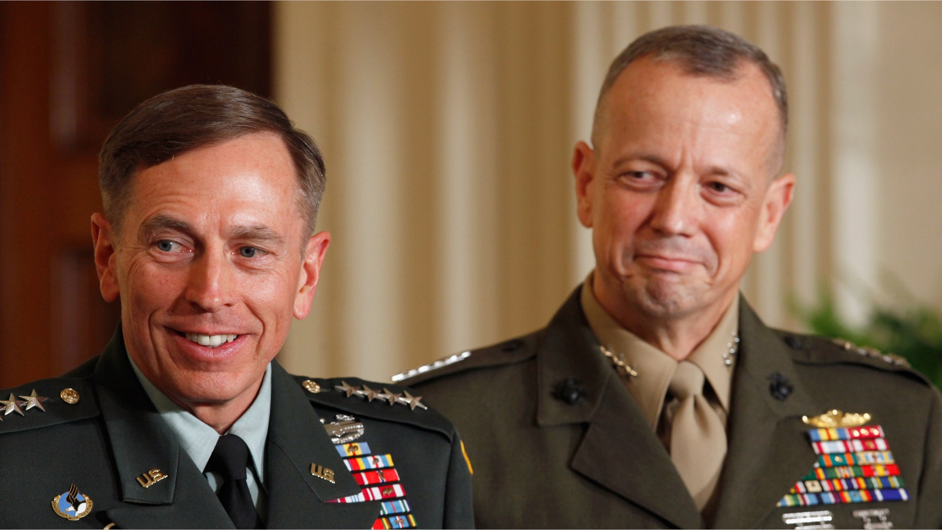 U.S. Army Gen. David Petraeus (L) and Marine Corps Gen. John Allen smile after President Barack Obama announced that he will nominate Allen to succeed Petraeus and Petreaus to succeed Leon Panetta as director of the CIA in the East Room of the White House April 28, 2011 in Washington, DC. (Photo by Chip Somodevilla/Getty Images)