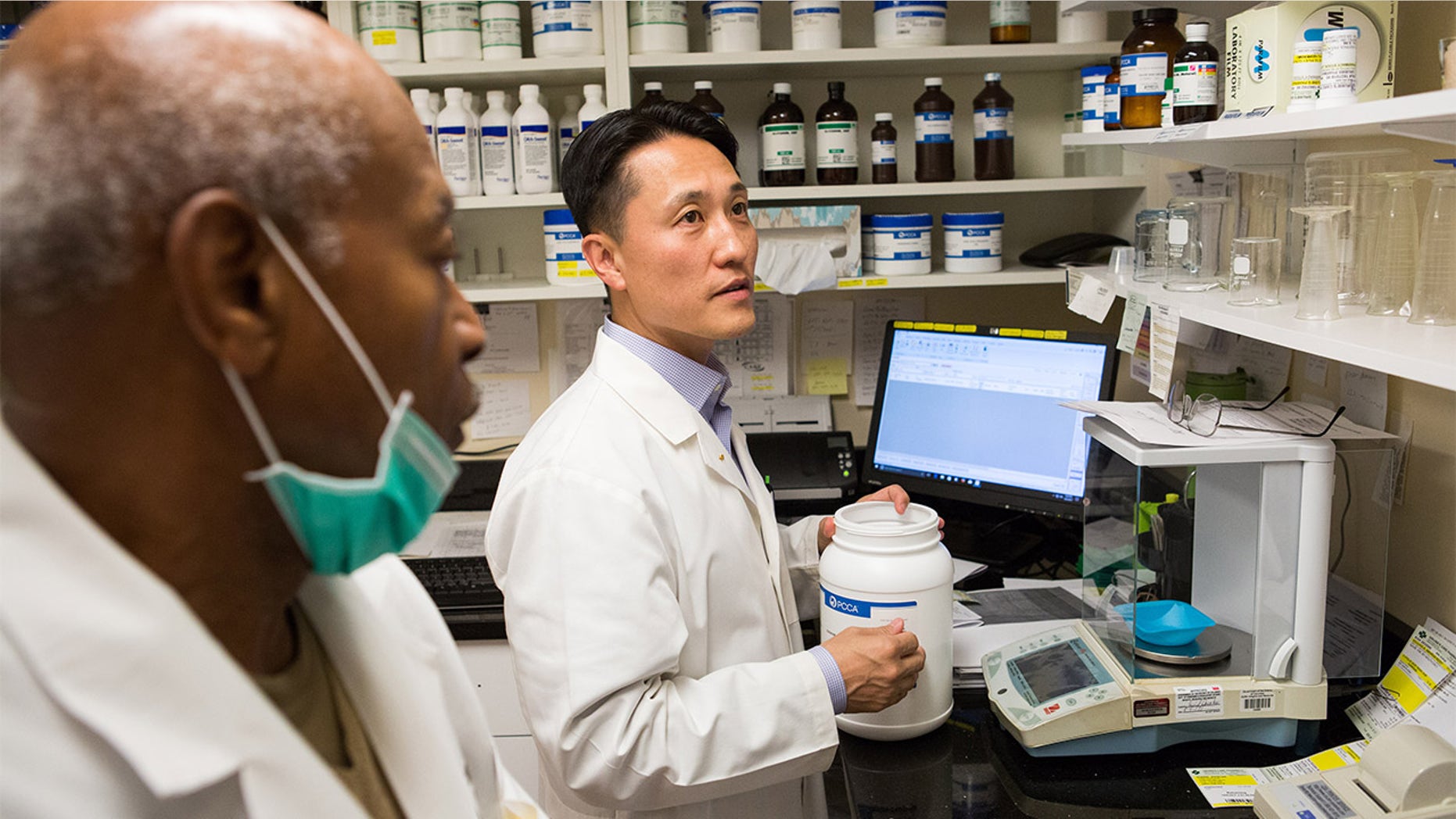 On October 6, 2017, Dr. Michael Kim (center), a pharmacist and owner of Grubb's Pharmacy, prepares medication in the compound of his Northeast, Washington D.C. store with Ron Thompson(left, Compound Technician). Grubb's Pharmacy, established in 1867, is the oldest pharmacy in D.C., and with its convenient location to the U.S. Capitol, services many Members of Congress.