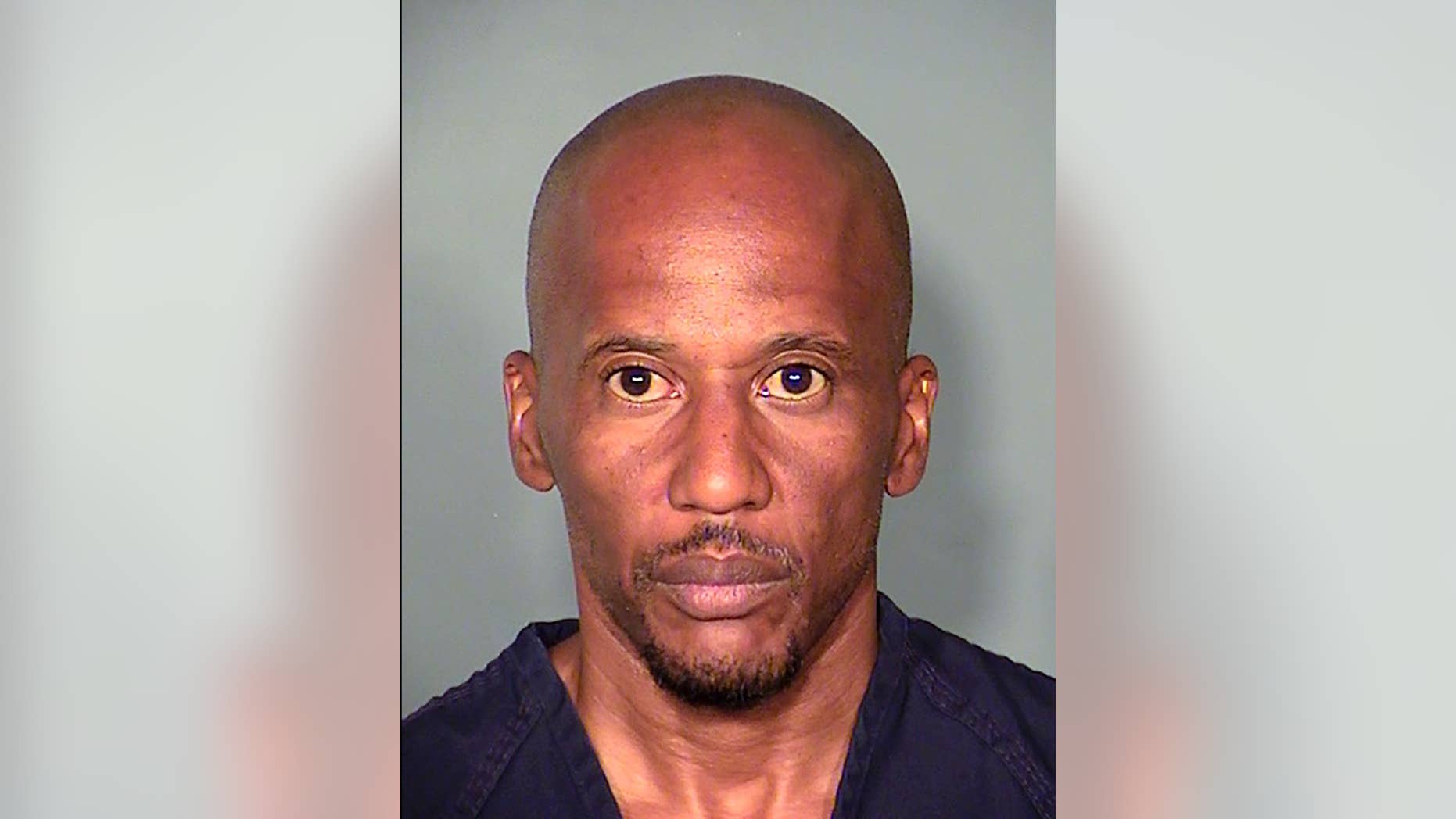 This Thursday, Aug. 6, 2015 booking photo released by the Las Vegas Metropolitan Police Department, shows suspect Leonard Ray Woods, 46 at the Clark County Detention Center North in Las Vegas. Police say security video shows Woods stalking and fatally stabbing his estranged girlfriend outside a Las Vegas pharmacy hours before he turned himself in. (Las Vegas Metropolitan Police Department via AP)