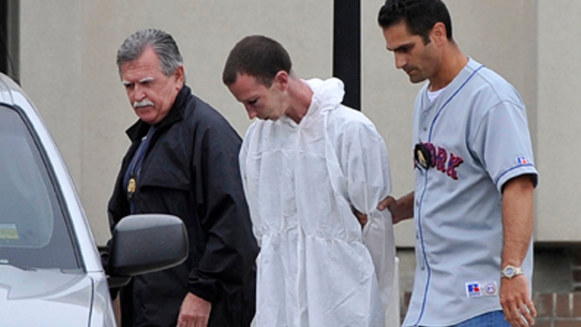 June 22: David Laffer, a suspect in the shooting deaths of four people at a pharmacy during a botched weekend painkiller robbery, is escorted out of Suffolk County Police Headquarters in Yaphank, N.Y.
