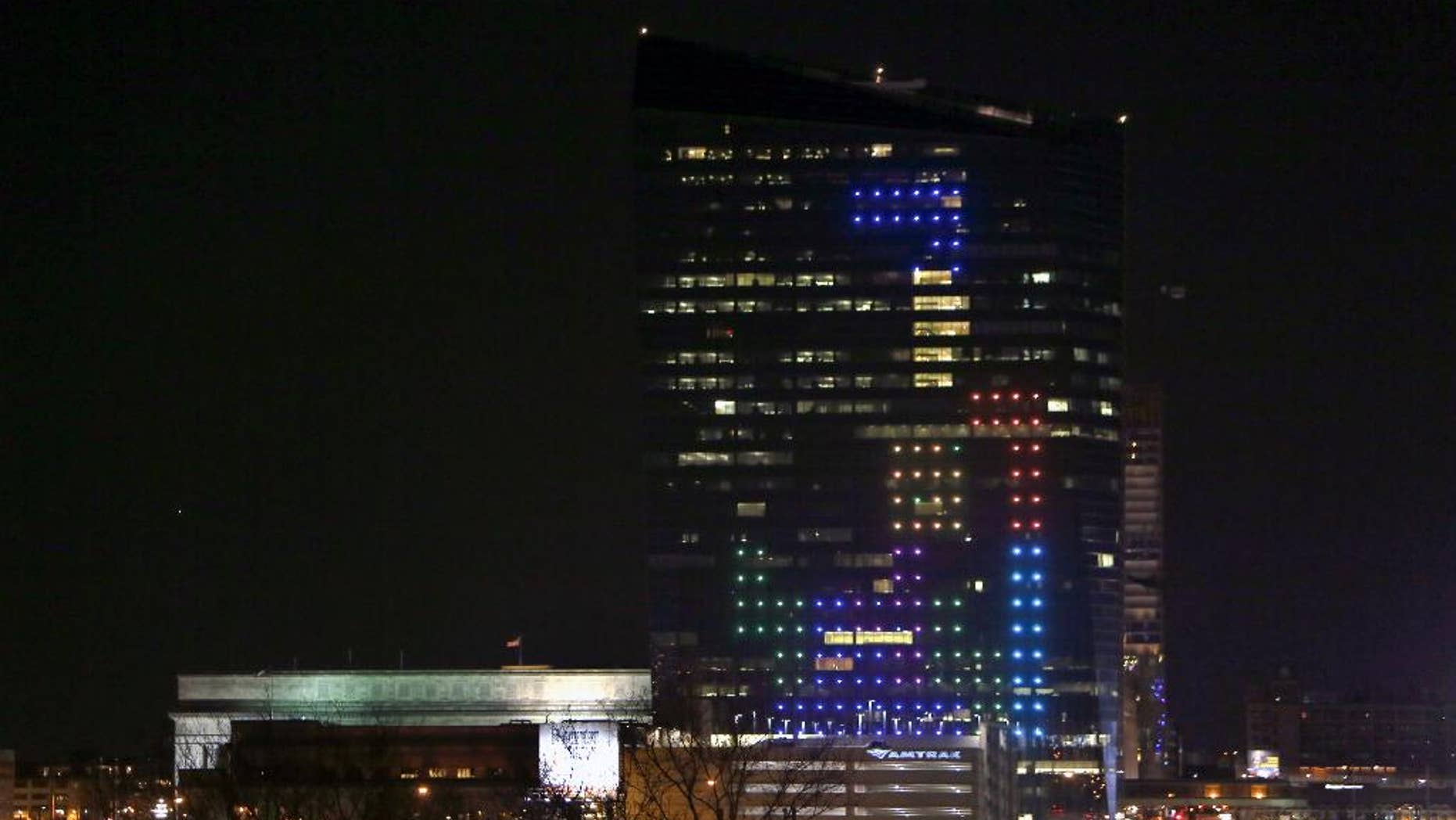 In this April 5, 2014 file photo shown is the classic video game Tetris played on the 29-story Cira Centre in Philadelphia, April 5, 2014, using hundreds of LED lights embedded in its glass facade. The spectacle kicks off a citywide series of events called Philly Tech Week and also celebrates the upcoming 30th anniversary of Tetris. (AP Photo/ Joseph Kaczmarek, File)