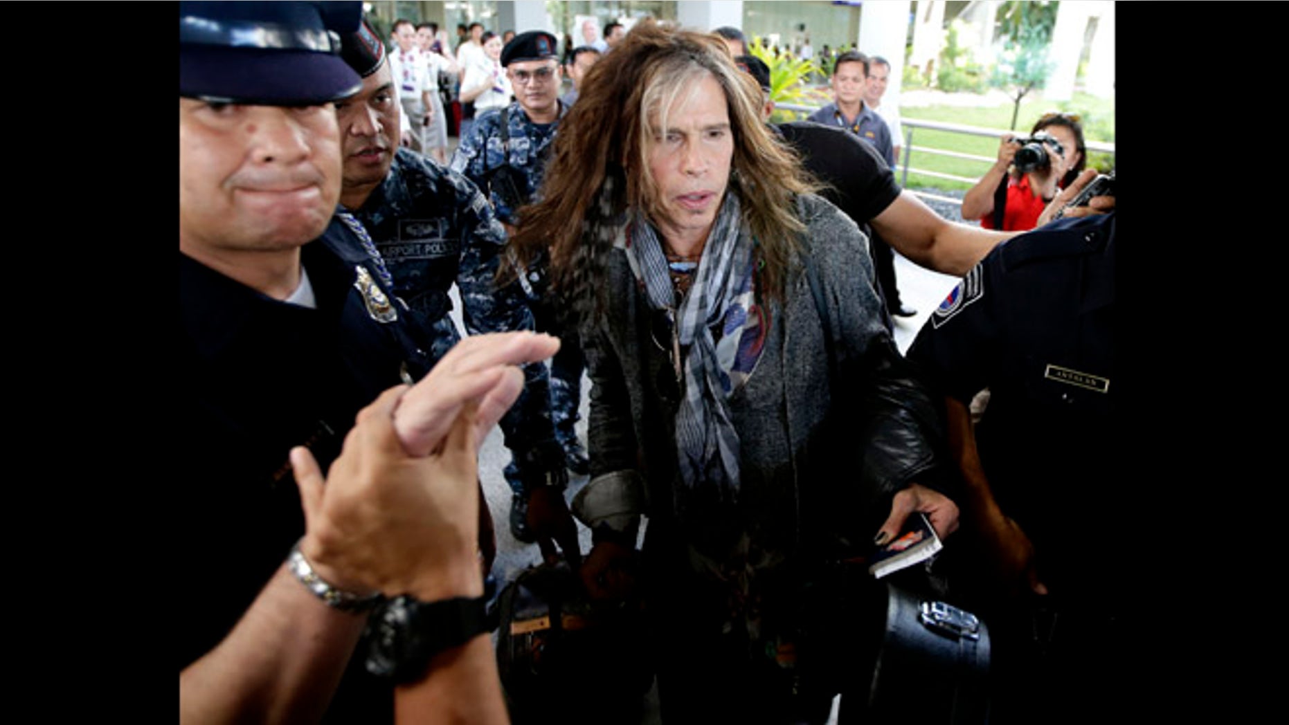 May 5, 2013: Steven Tyler of the famed Aerosmith rock band is mobbed by reporters as he makes his way to his waiting van upon arrival from Melbourne in Manila, Philippines. Tyler and his entourage are here as part of their band's world tour concert.