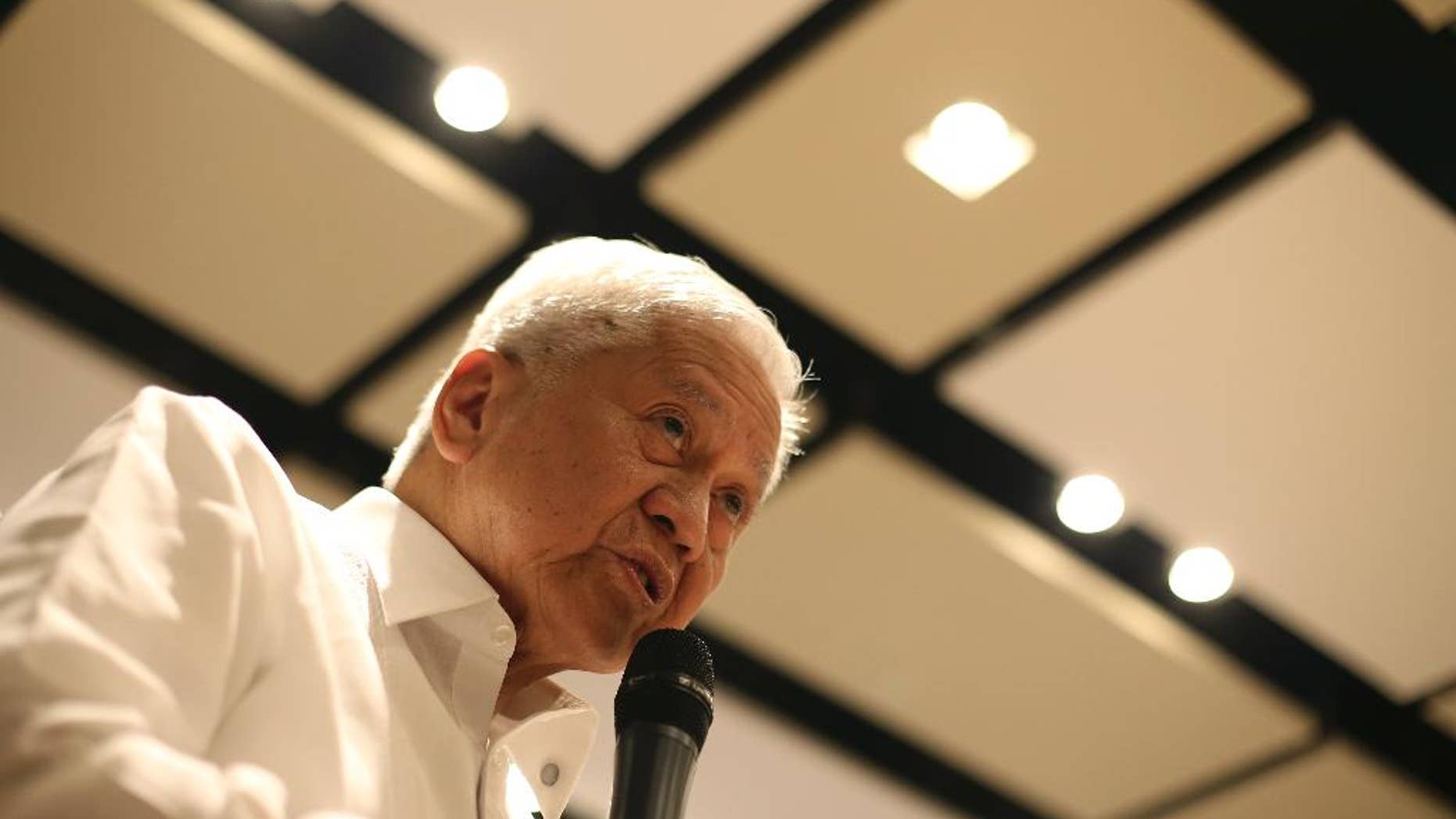 Philippine Foreign Secretary Albert del Rosario speaks during a news forum in suburban Pasig, east of Manila, Philippines Thursday, March 26, 2015. Rosario said China has been rushing construction projects, including massive land reclamations in the disputed South China Sea, before it gets potentially restricted by a proposed nonaggression pact and a case questioning the legality of Beijing's territorial claims. (AP Photo/Aaron Favila)