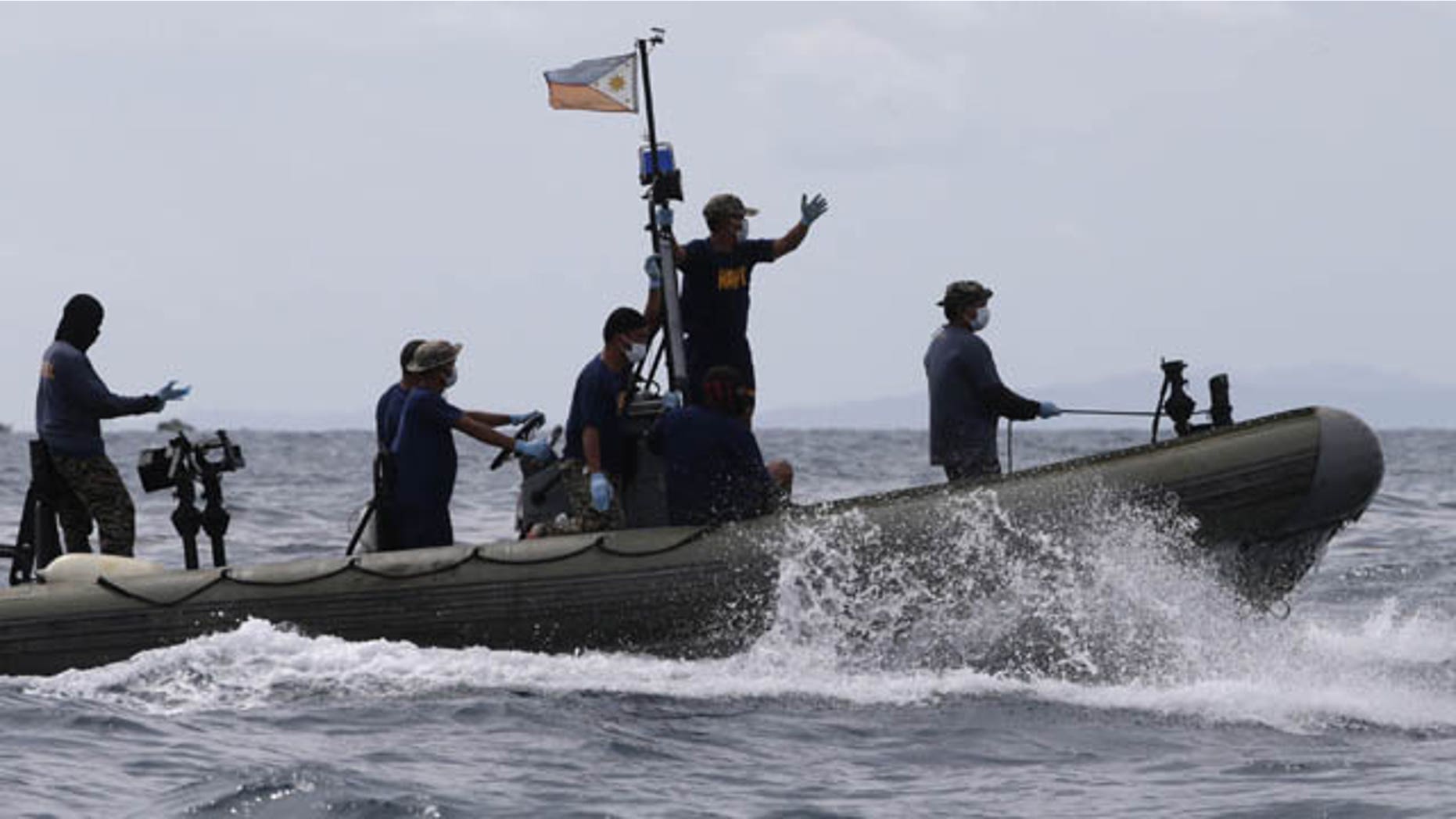 August 18, 2013: Philippine Navy and Coast Guard divers continue their search and rescue operation off Talisay coast, Cebu province following Friday night's collision of the passenger ferry MV Thomas Aquinas and the cargo ship MV Sulpicio Express Siete in central Philippines.