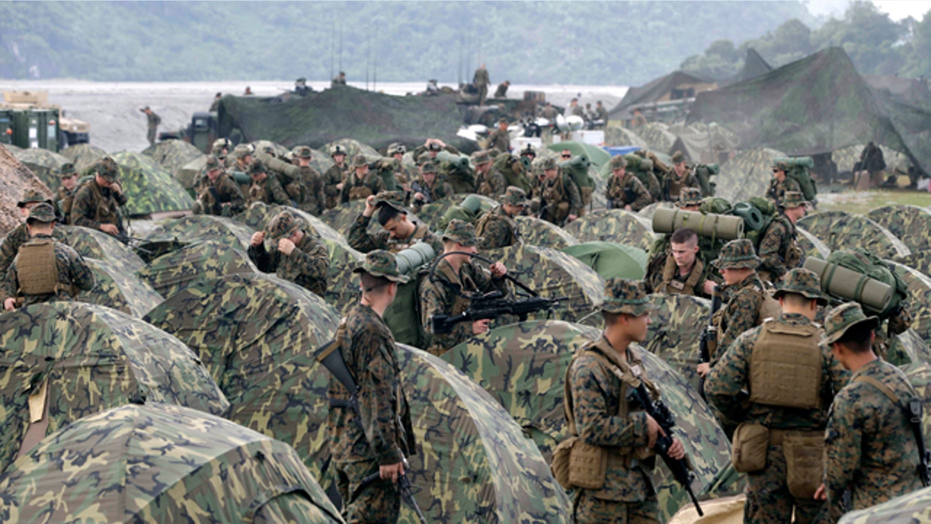 Oct. 9, 2012: In this file photo, U.S. Marines fix their tents as they arrive at Crow Valley, Tarlac province in northern Philippines, to take part in the joint U.S.-Philippines amphibious landing exercise, dubbed PHIBLEX 2013.