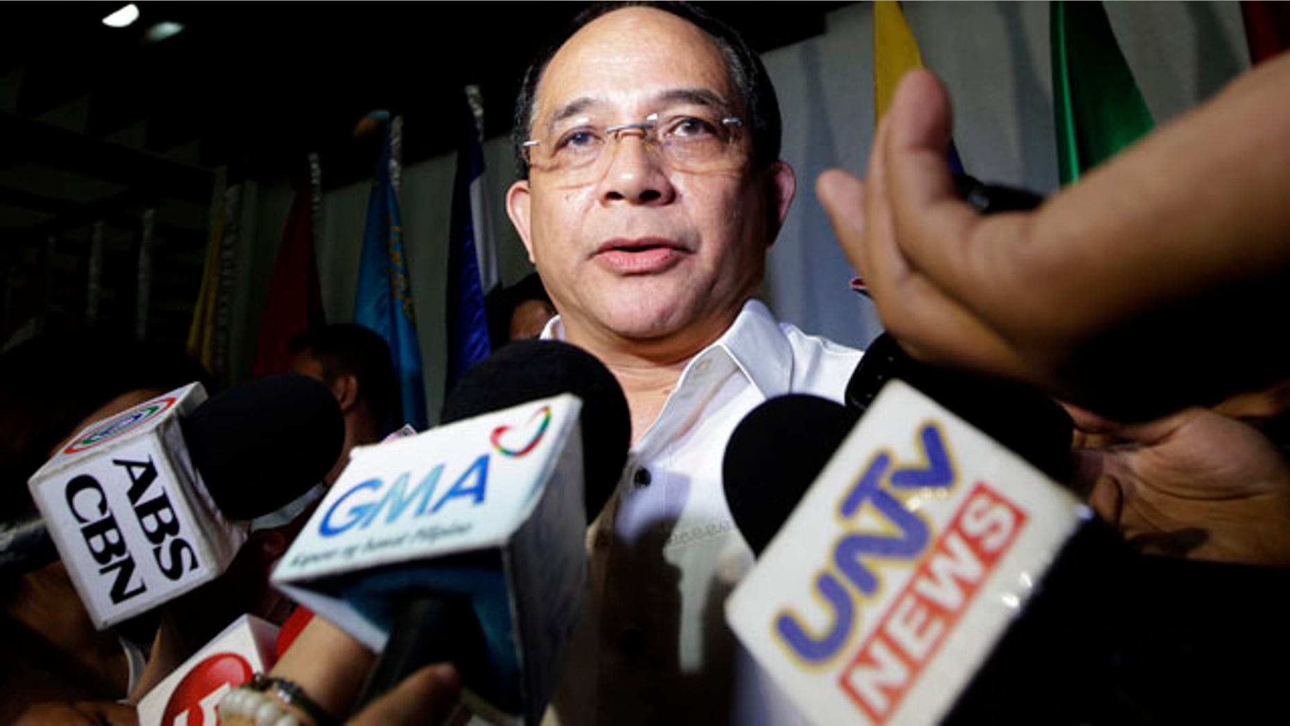 October 13, 2014: Eduardo Oban Jr., head of the Visiting Forces Agreement Commission which is tasked to paving the way for hundreds of U.S. forces to hold combat exercises with Filipino troops in the south, talks to the media on the possible involvement of a 'foreigner' in the killing of a transgender at Olongapo city, in northwestern Philippines, which houses a former U.S. naval base off Subic Bay. (AP Photo/Bullit Marquez)