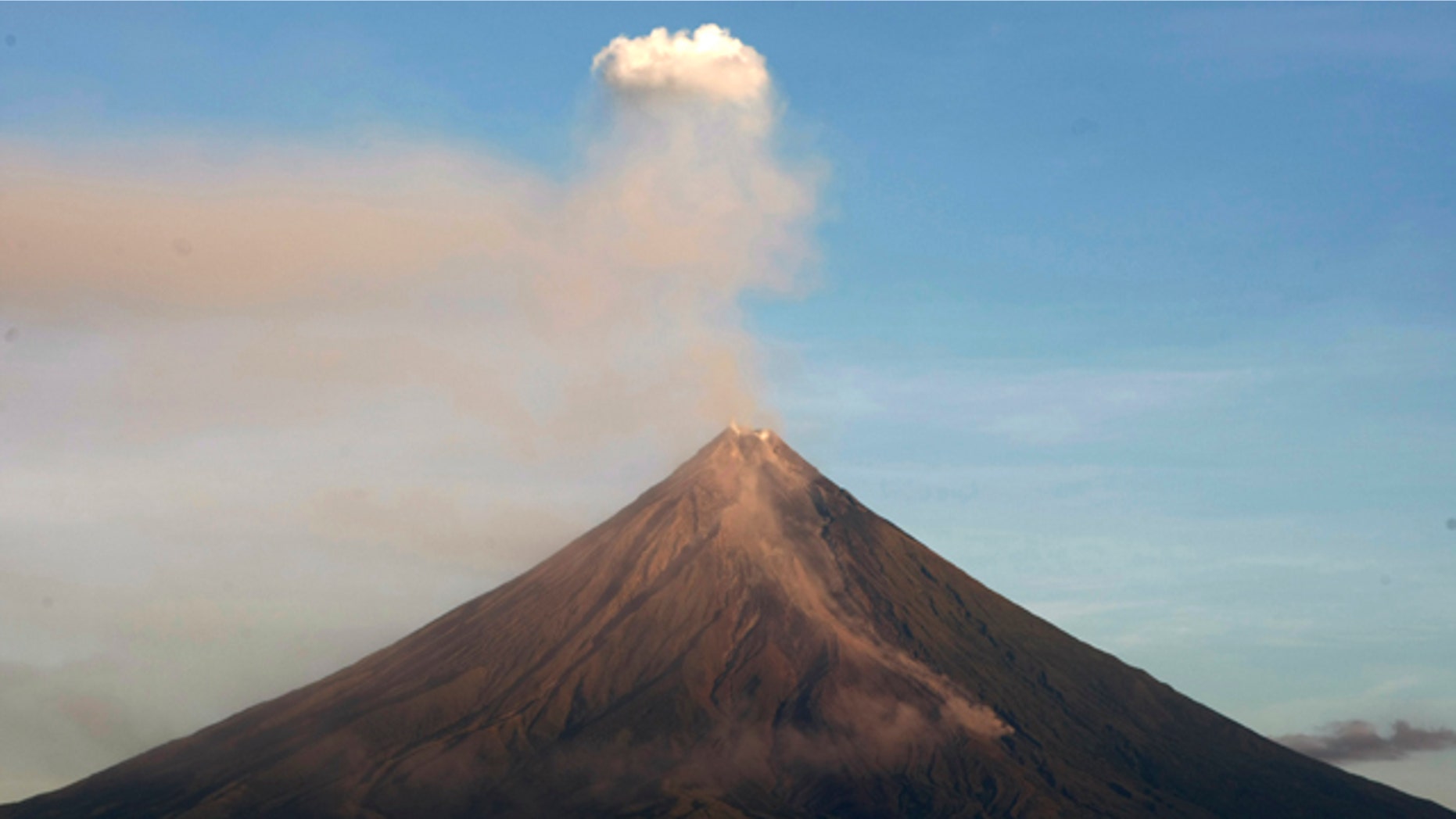 Mayon volcano spews ash anew in another "ash explosion" as viewed in Legazpi city, Albay province, about 500 kilometers south of Manila. Security forces will forcibly evacuate thousands of residents reluctant to leave their farms around the slopes of the country's most active volcano despite fears of a major eruption.