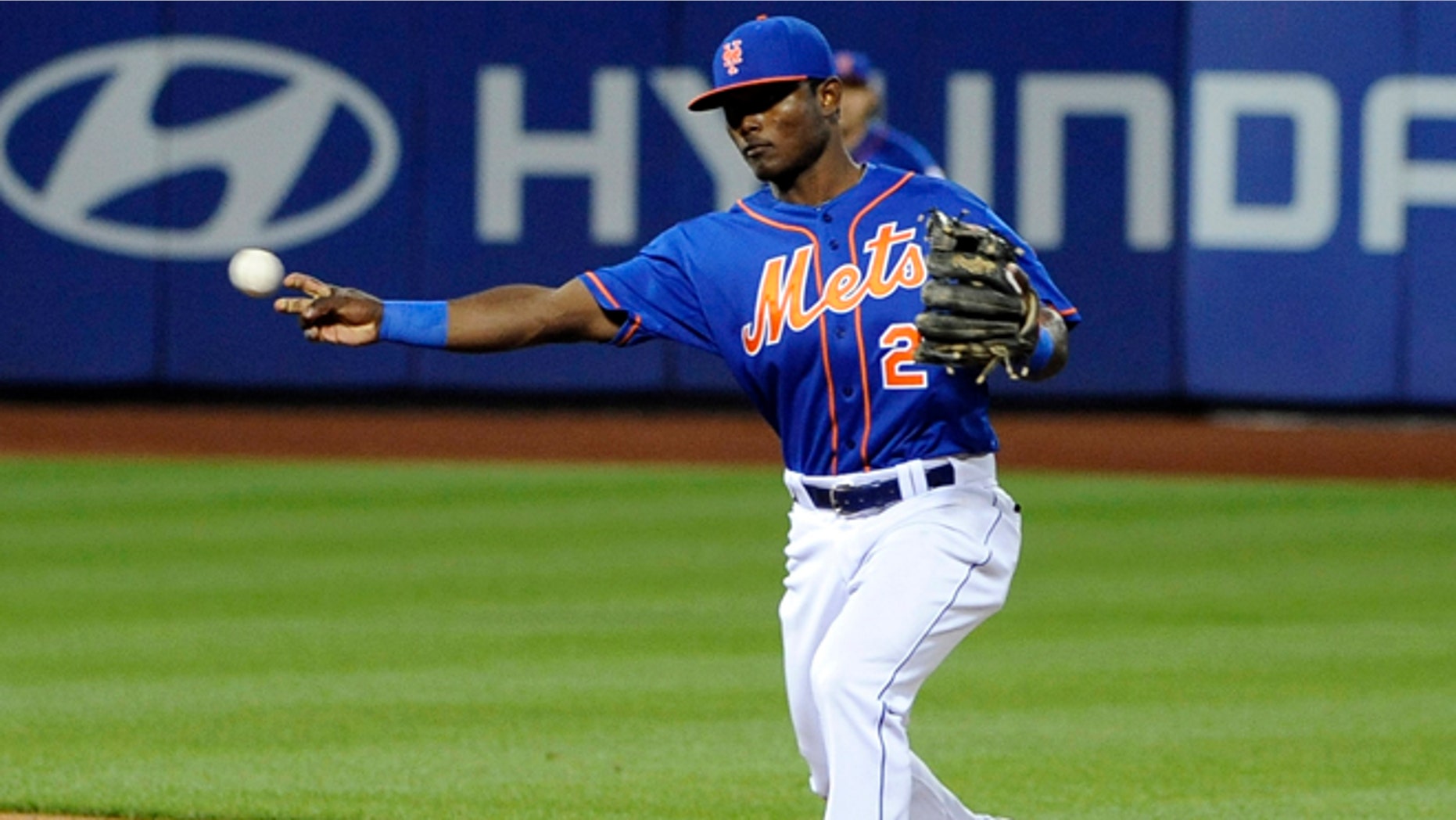 New York Mets second baseman Dilson Herrara throws out Philadelphia Phillies' Grady Sizemore in the second inning of a baseball game at Citi Field on Friday, Aug. 29, 2014, in New York. (AP Photo/Kathy Kmonicek)