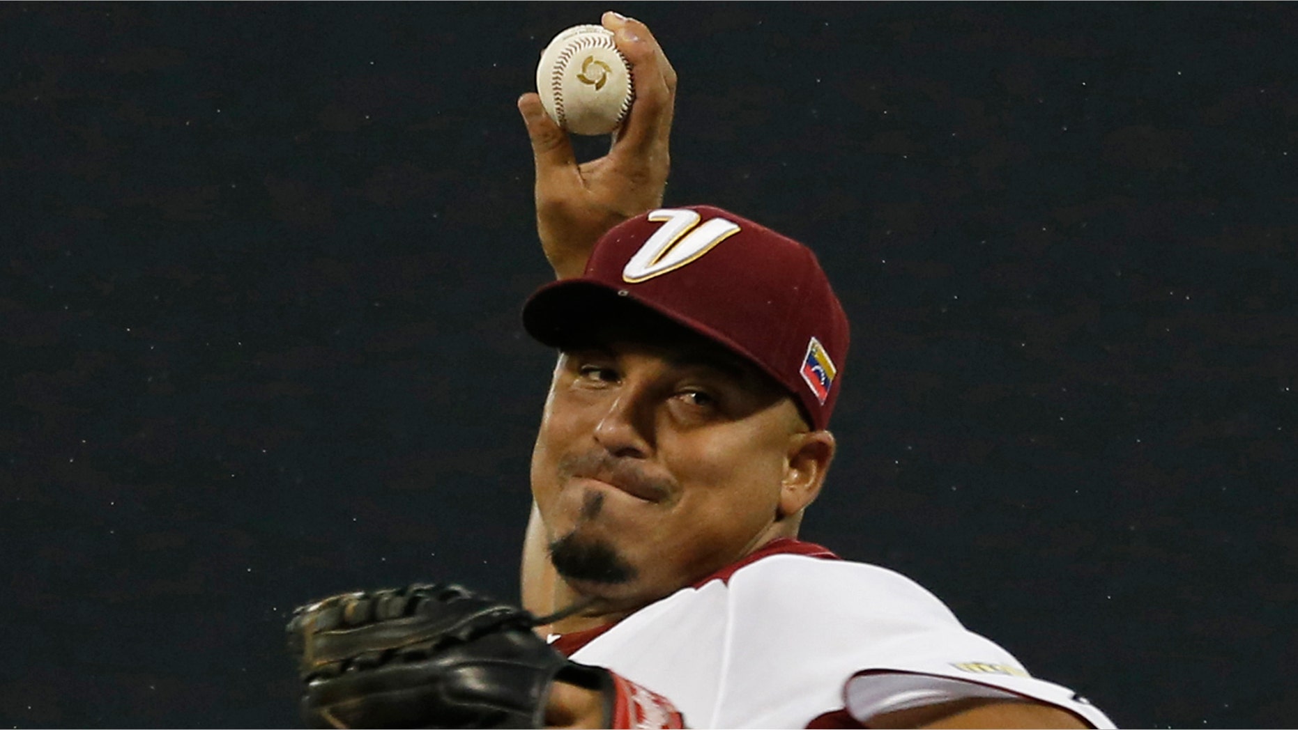 In this March 9, 2013 photo, Venezuela starting pitcher Carlos Zambrano throws in the first inning of a World Baseball Classic first round game against Puerto Rico in San Juan, Puerto Rico.