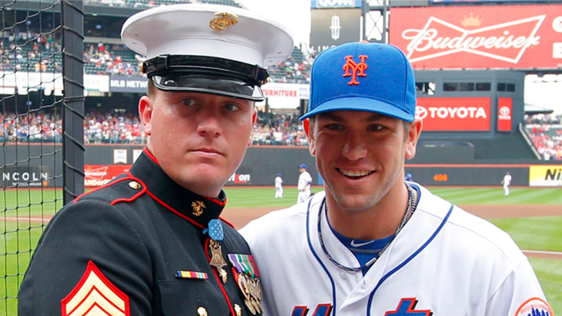 Sept. 24: Medal of Honor recipient Dakota Meyer of the U.S. Marine Corps is presented with an American flag by New York Mets' Josh Thole.