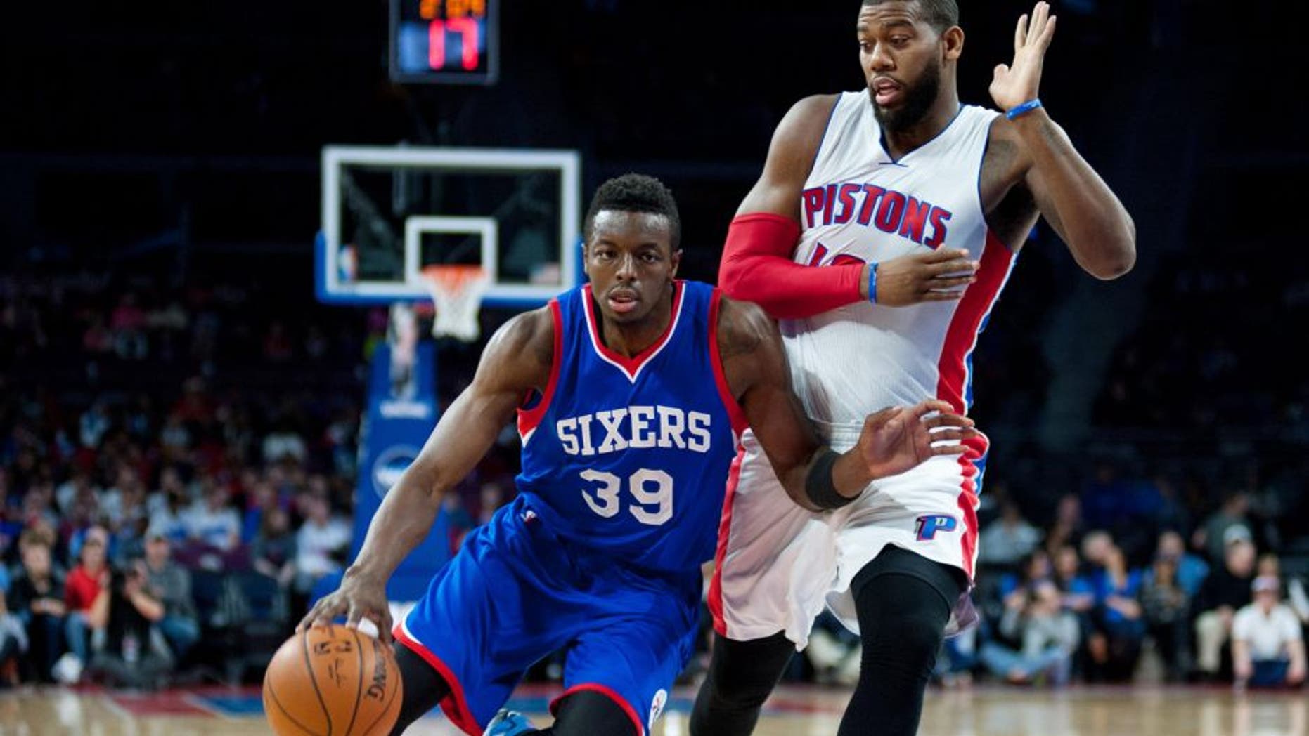 Dec 6, 2014; Auburn Hills, MI, USA; Philadelphia 76ers forward Jerami Grant (39) drives past Detroit Pistons forward Greg Monroe (10) during the first quarter at The Palace of Auburn Hills. Mandatory Credit: Tim Fuller-USA TODAY Sports