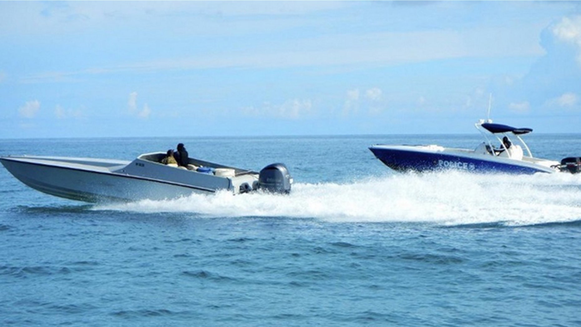 Sept. 18 2014: A maritime patrol aircraft detected this 40-foot go-fast vessel in the Caribbean Sea. DEA and Bahamian Police officials responded to the location and detained two suspects after locating 40 bales of marijuana. (U.S. Coast Guard photo)