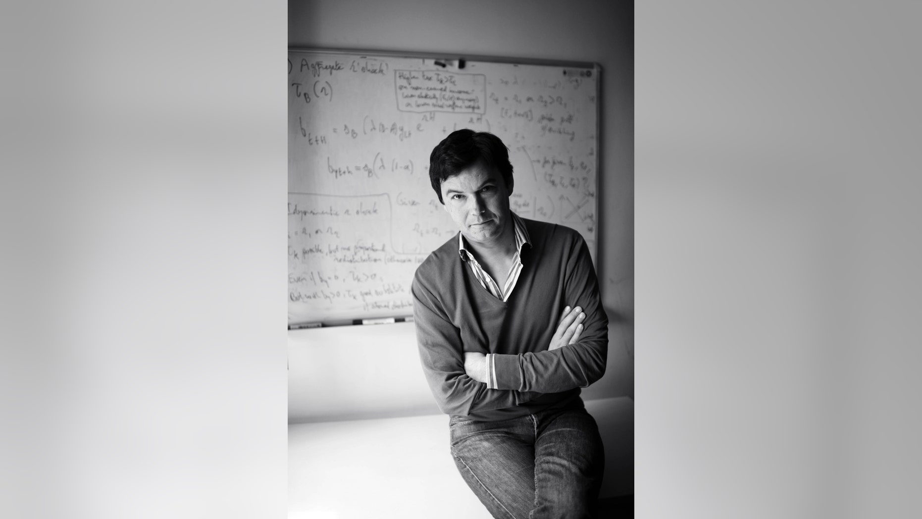FILE -- This undated photo provided by Harvard Press shows French economist Thomas Piketty. In his new book, Piketty, who helped popularize the notion of a privileged 1 percent, sounds a grim warning: The U.S. economy is beginning to decay into the aristocratic Europe of the 19th century.
