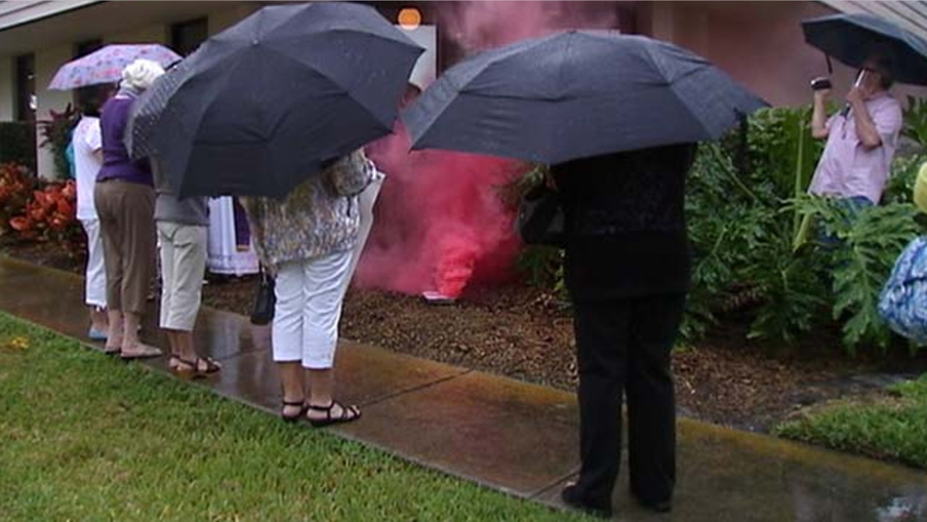Members of a church in Sarasota sent up their own smoke signals Tuesday -- not black or white, but pink.