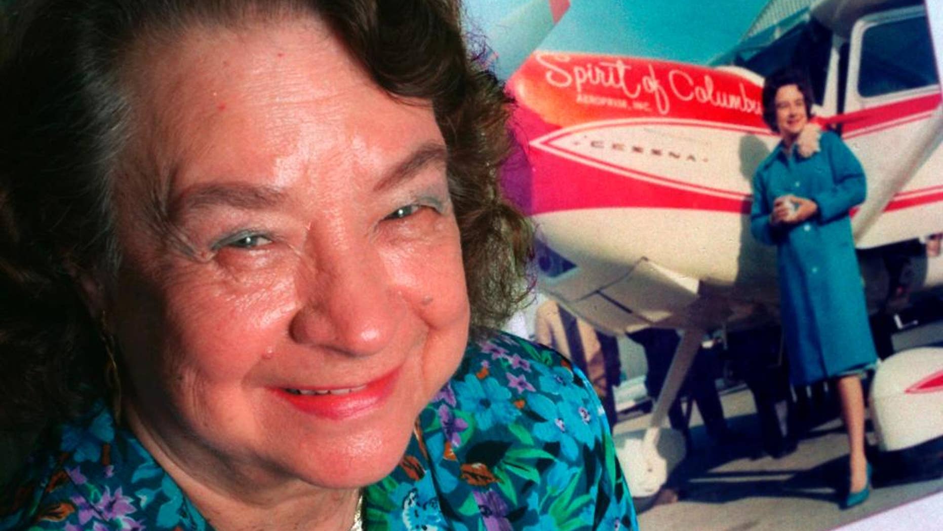 This photo made March 25, 1994, in Quincy, Florida, shows Jerrie Mock posing next to a photograph of her that was taken minutes before her historic around-the-world flight in 1964. Fifty years ago Mock became the first woman to fly solo around the world. The flight took her a little over 29 days in the "Spirit of Columbus". (AP Photo/Tallahasee Democrat/Mike Ewen)
