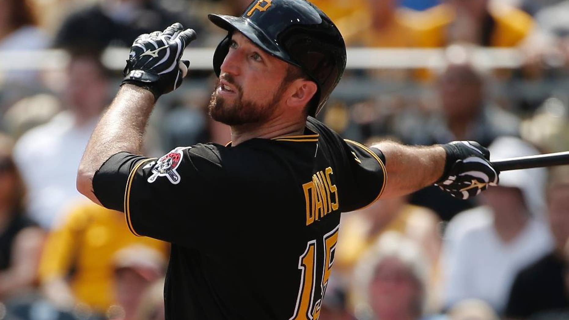 FILE - In this Aug. 27, 2014, file photo, Pittsburgh Pirates' Ike Davis (15) bats during the fourth inning of a baseball game against the St. Louis Cardinals in Pittsburgh. The Oakland Athletics have filled their second key position in five days, acquiring first baseman Ike Davis and international bonus slot 86 from the Pittsburgh Pirates in exchange for international bonus slot 27. (AP Photo/Gene J. Puskar)