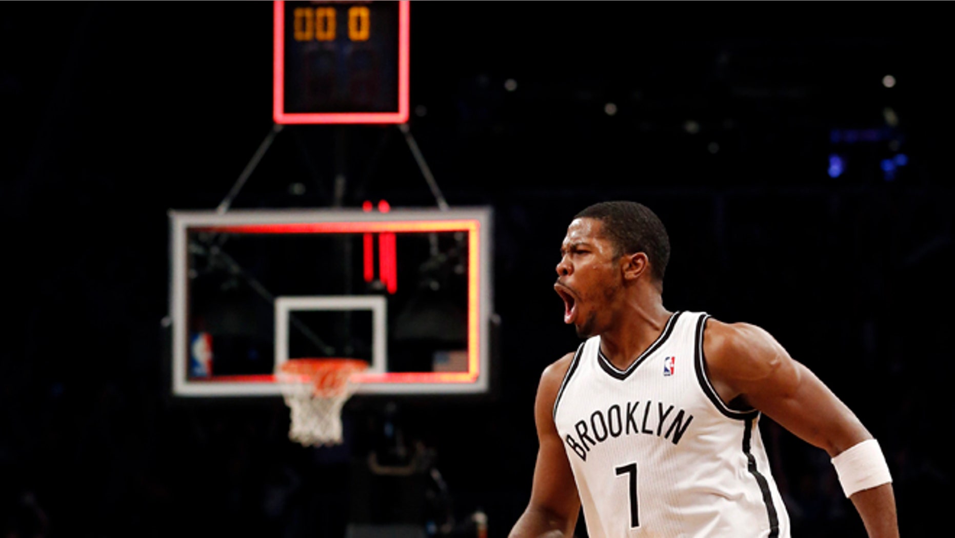 Brooklyn Nets guard Joe Johnson (7) celebrates after hitting the game winning shot for a 107-105 victory in double overtime against the Detroit Pistons after their NBA basketball game at Barclays Center, Friday, Dec. 14, 2012, in New York. (AP Photo/John Minchillo)