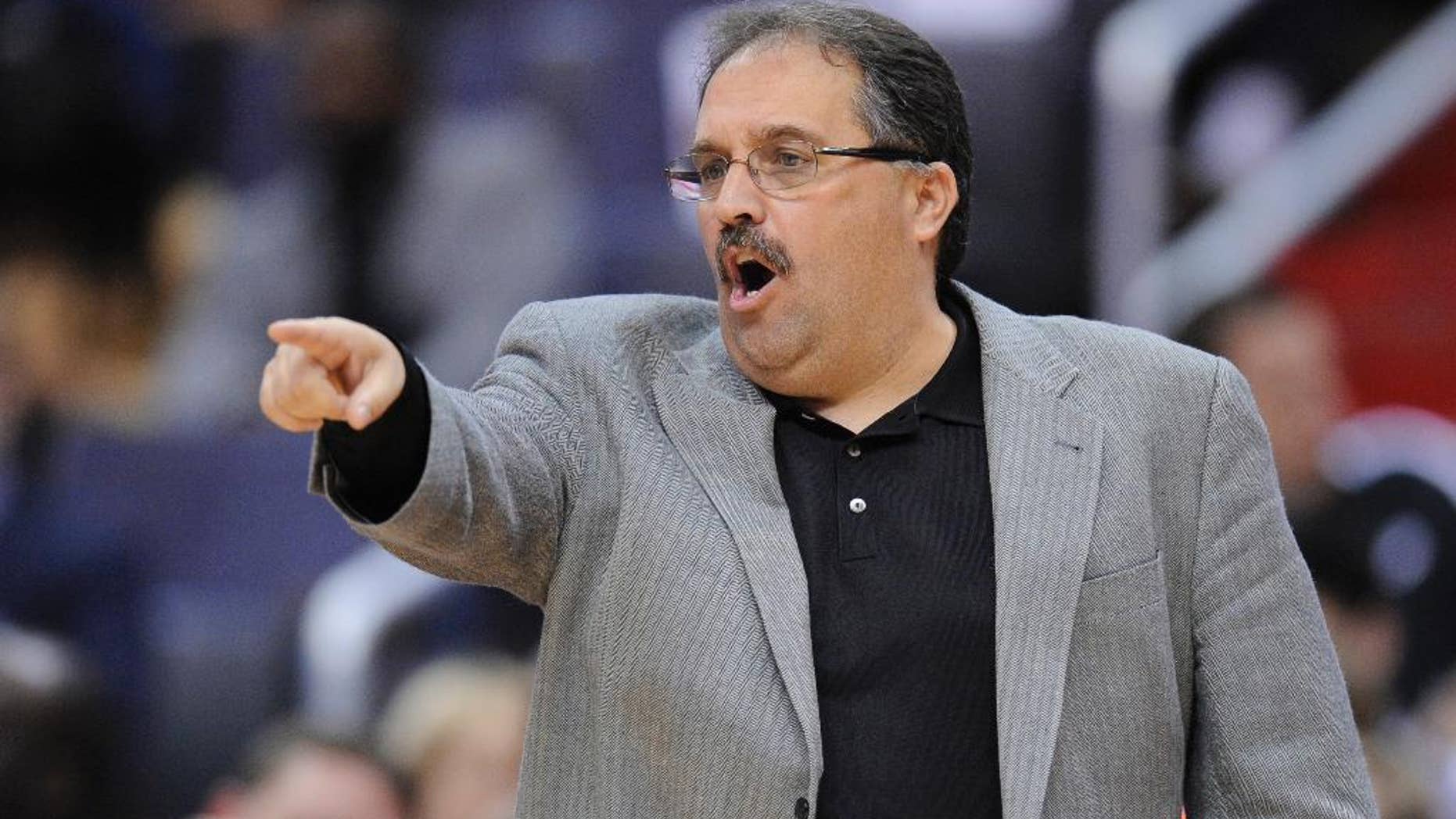 In this April 10, 2012, photo, then-Orlando Magic coach Stan Van Gundy gestures during the Magic's NBA basketball game against the Washington Wizards in Washington. A person with knowledge of the details says Van Gundy has agreed to a $35-million, five-year contract to be the Detroit Pistons' coach and president of basketball operations. Detroit gave Van Gundy the powerful combination of jobs on Tuesday, May 13, 2014, the person told The Associated Press on condition of anonymity because the deal had not been announced. (AP Photo/Nick Wass)