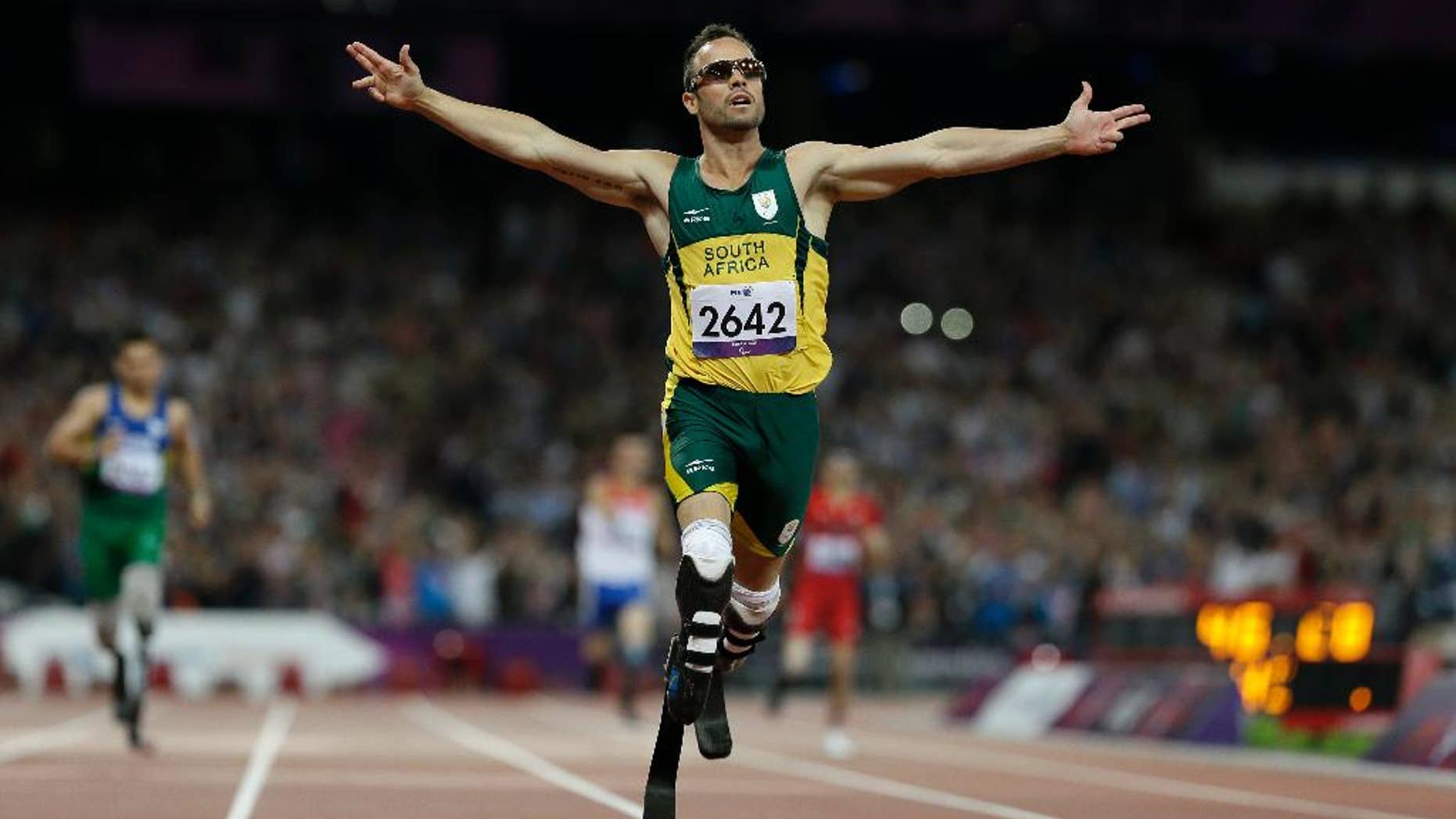 FILE - In this Saturday, Sept. 8, 2012 file photo, South Africa's Oscar Pistorius wins gold in the men's 400-meter T44 final at the 2012 Paralympics, in London. The man who racing commentators said was slow from the starting blocks, Pistorius went on to win many medals for his running prowess, but is now expected to testify in his own defense during his trial in South Africa for the killing of his girlfriend Reeva Steenkamp. (AP Photo/Kirsty Wigglesworth, File)