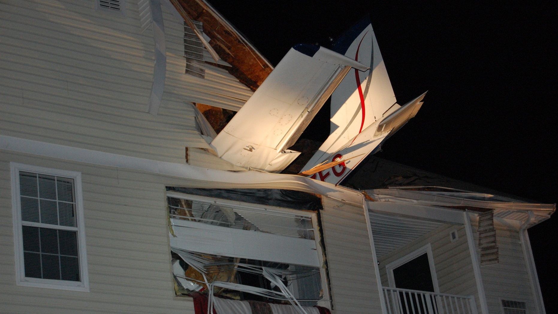 May 31, 2013: This handout photo provided by the Virginia State Police shows a small plane crashed into the living room of an apartment in Herndon, Va. Capt. Willie Bailey with Fairfax County Fire and Rescue in Virginia says the plane ran out of fuel early Friday and crashed, injuring two people one in the apartment and one in the Cessna 177B.