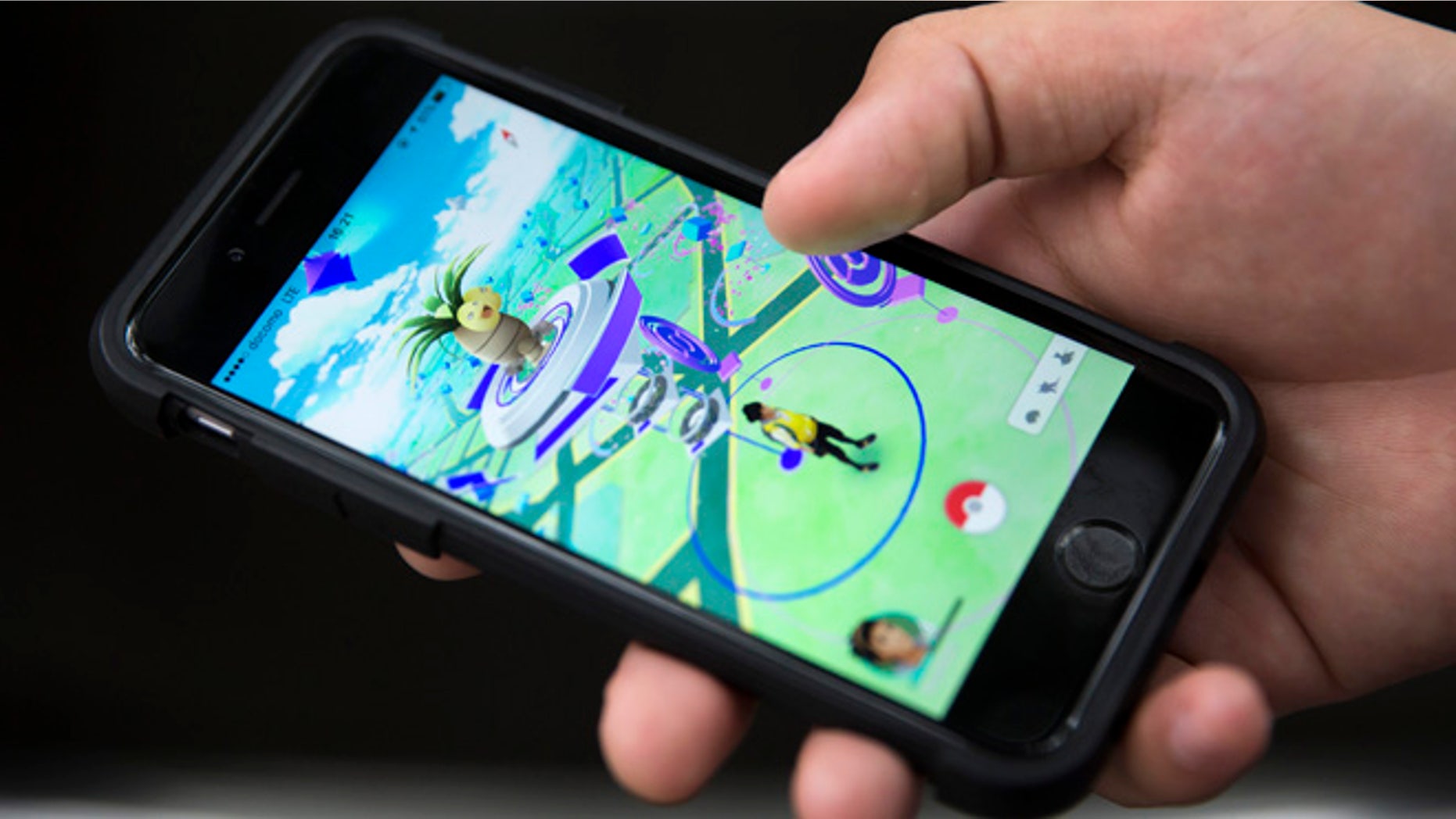 TOKYO, JAPAN - JULY 22: A man plays Pokemon Go game on a smartphone on July 22, 2016 in Tokyo, Japan. The Japanese version of the game app Pokemon Go was released on July 22, 2016. Japan McDonalds' 3,000 restaurants in Japan will be turned into Pokemon gyms in collaboration with the fast-food chain. (Photo by Tomohiro Ohsumi/Getty Images)