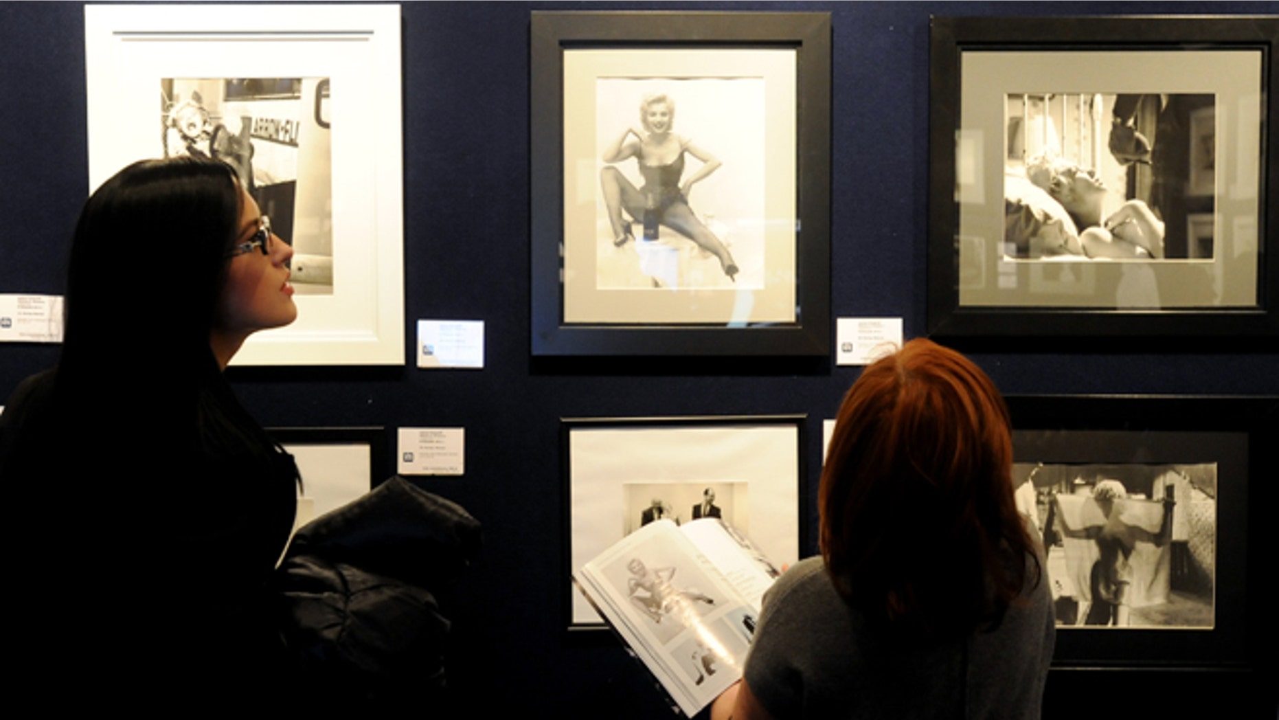 Nov. 8, 2012: Potential bidders look at Marylin Monroe photos prior to an auction of pictures by the late celebrity photographer Milton H. Greene, in Warsaw, Poland.