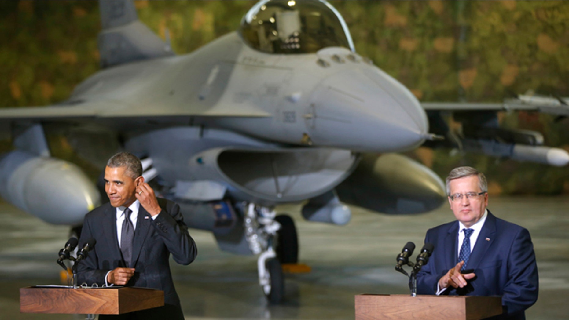 June 3, 2014: U.S. President Barack Obama and Poland's President Bronislaw Komorowski make statements and meet with U.S. and Polish troops at an event featuring four F-16 fighter jets, two American and two Polish, as part of multinational military exercises, in Warsaw. (AP Photo/Charles Dharapak)
