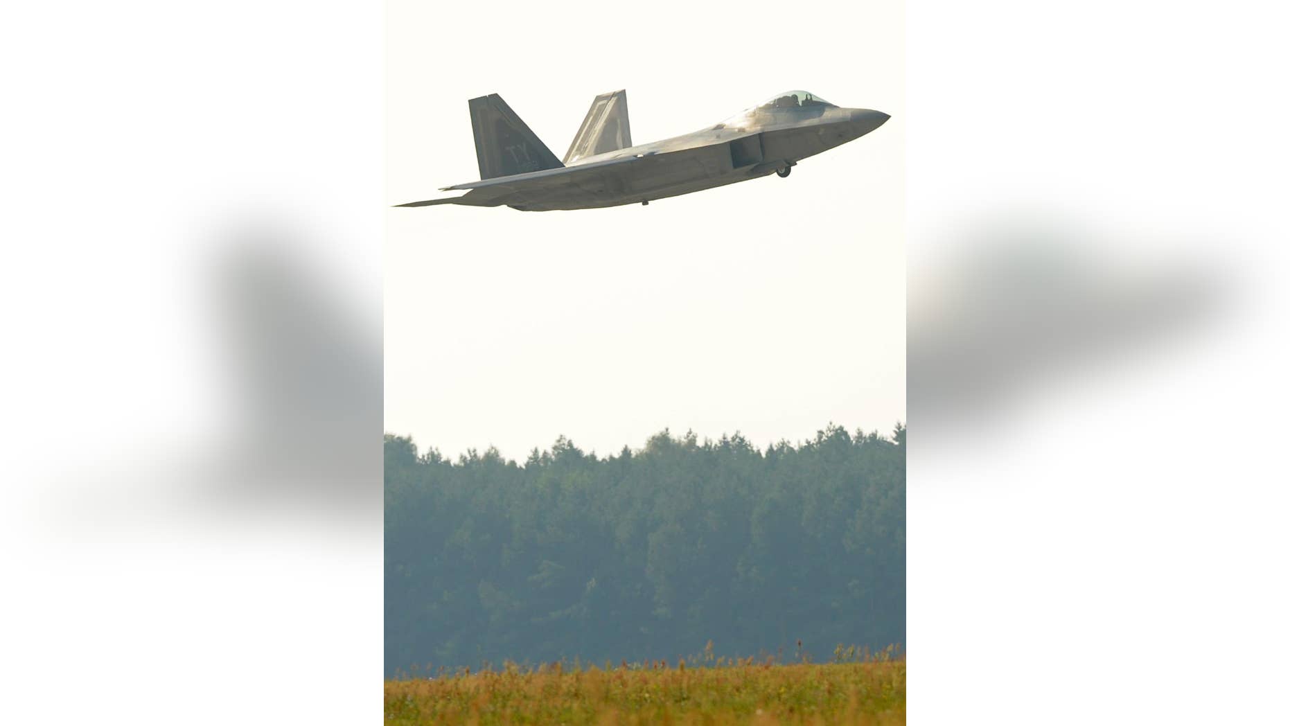 U.S. stealthy high-tech F-22 Raptor fighter jet flies above the military base in Lask, Poland, Monday, Aug. 31, 2015. Two Raptors came to Lask as a part of the inaugural F-22 training deployment to Europe. (AP Photo/Alik Keplicz)