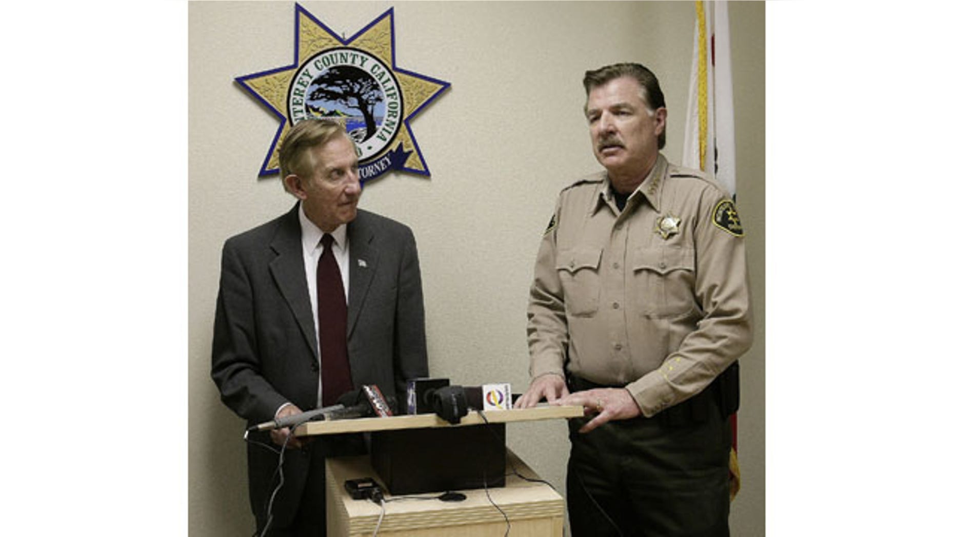 February 25, 2014: Monterey County District attorney Dean Flippo, left, and Monterey County Sheriff Scott Miller answer questions during a news conference in Salinas, Calif. Flippo said that six King City, Calif. officers, including the recently retired police chief and the acting chief, have been arrested, in connection to a scheme to steal more than 200 cars from poor Hispanic people. (AP Photo/The Monterey County Herald, Vern Fisher)