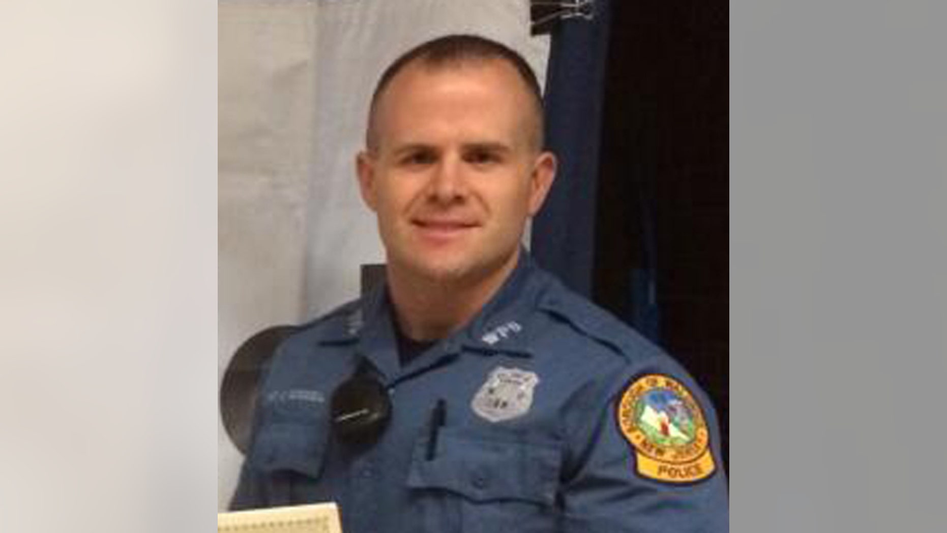 This June 11, 2014 image provided by the Waldwick Police Department shows Waldwick, N.J. police officer Christopher Goodell during a ceremony honoring him for his DWI efforts. Authorities say the experienced police officer in northern New Jersey has died early Thursday July 17, 2014 after a tractor-trailer rear-ended his unmarked police car while he was operating radar to look for speeders on Route 17. Waldwick Police Officer Christopher Goodell was 32 years old. (AP Photo/Waldwick Police Department)