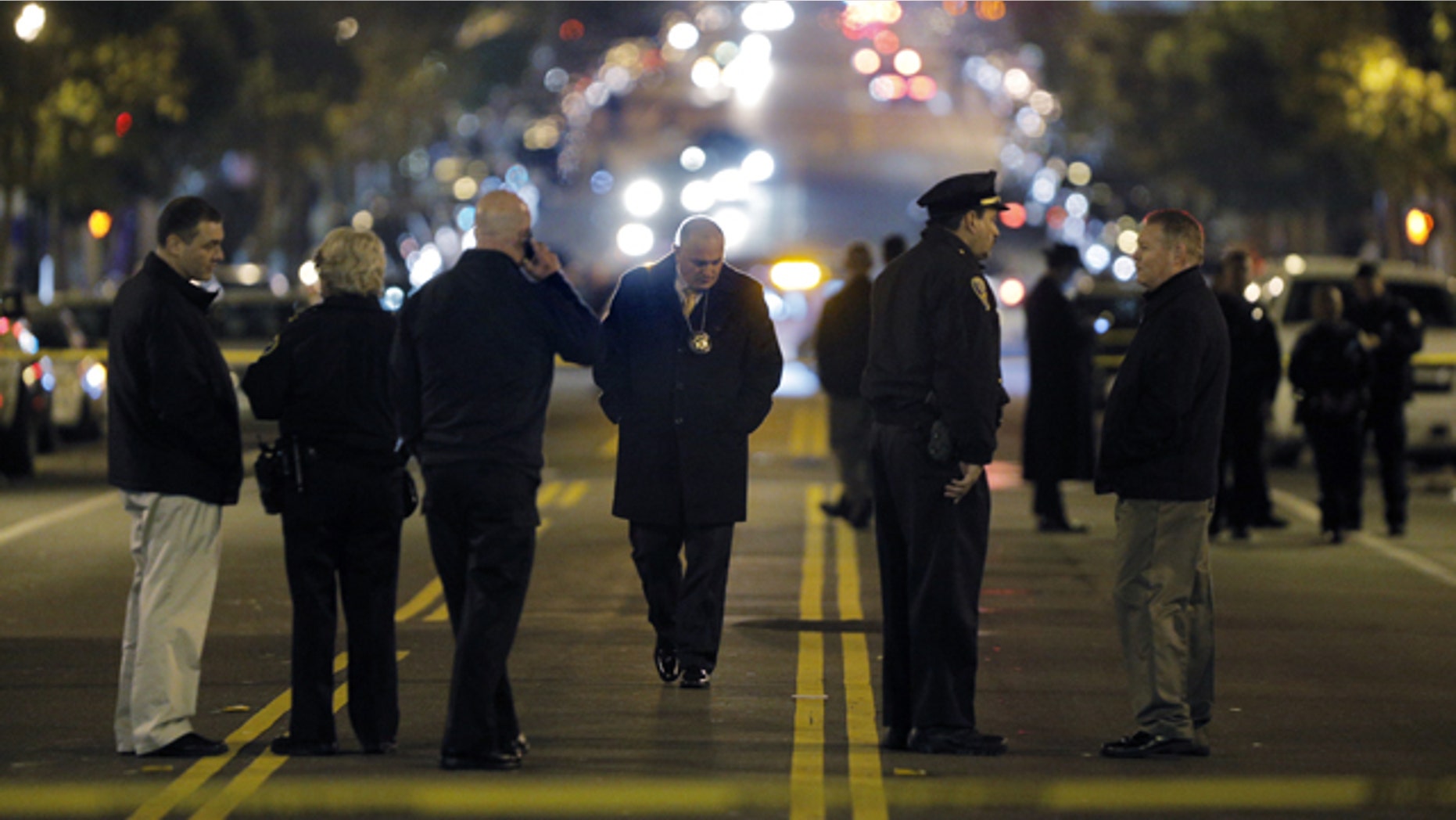 Jan: 4, 2015: Police investigators search for evidence after an officer-involved shooting at the San Francisco Police Mission Station in San Francisco. Officers shot and killed a man who brandished what appeared to be a handgun but was actually an air gun after they told him to leave a restricted parking lot. (AP Photo/San Francisco Chronicle, Carlos Avila Gonzalez)