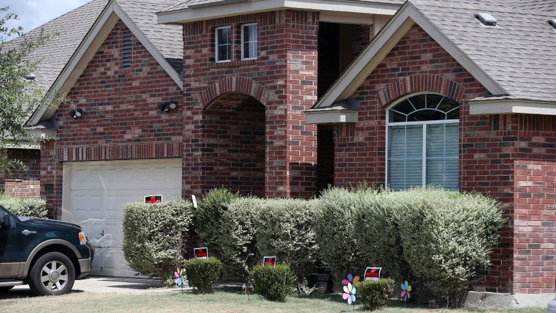 No trespassing signs are visible at the house Tuesday, Sept. 1, 2015, where deputies fatally shot Gilbert Flores, in Northwest Bexar County, Texas, near San Antonio, last Friday. A Texas prosecutor says a second video has emerged that gives authorities a “very clear view” of a confrontation between deputies and Flores who had his hands raised before he was shot and killed. (John Davenport/The San Antonio Express-News via AP) RUMBO DE SAN ANTONIO OUT; NO SALES; MANDATORY CREDIT