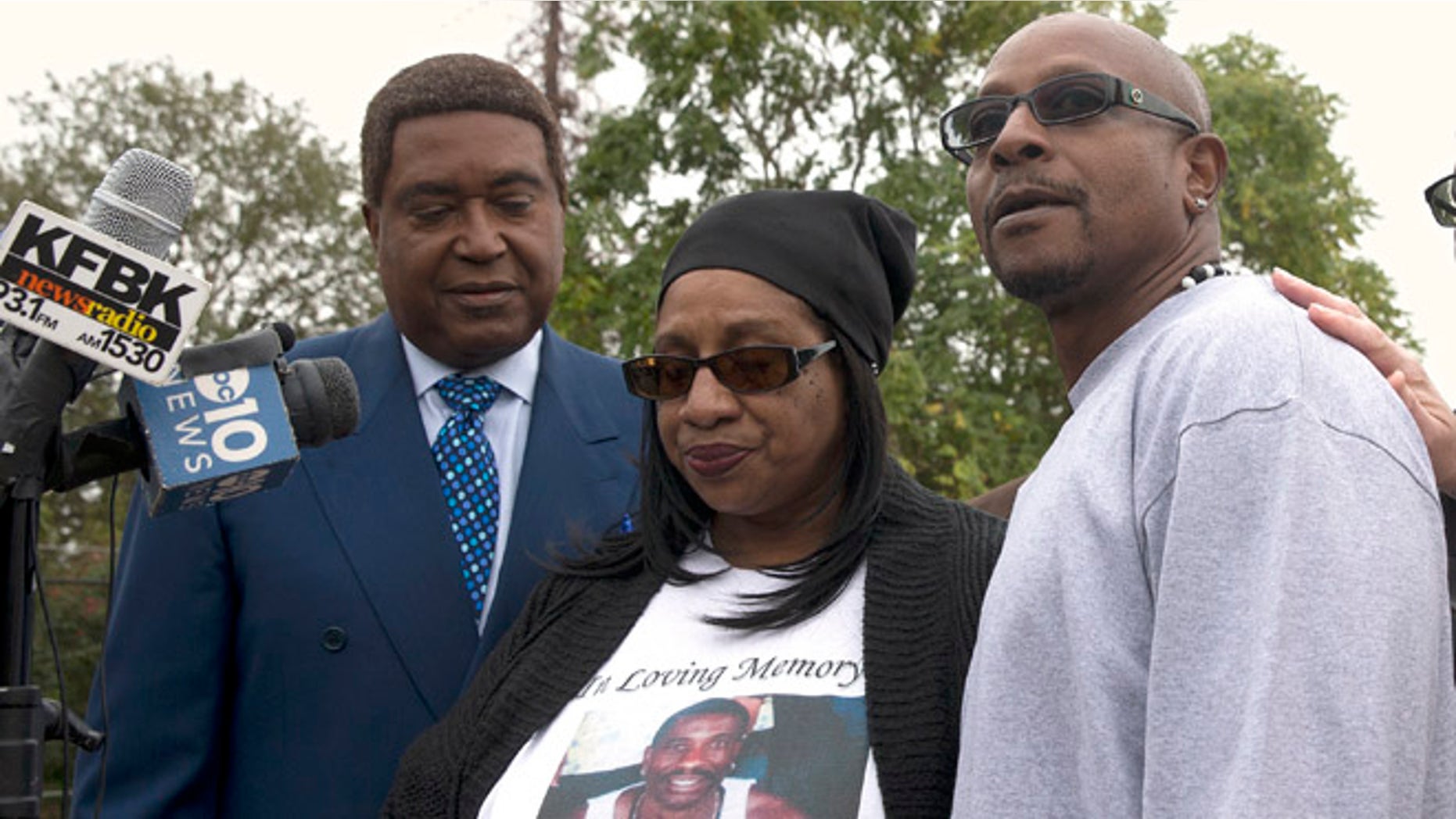 Robert Mann, right, the brother of Joseph Mann, who was killed by Sacramento Police in July, discusses the shooting of his brother during a news conference Monday, Oct. 3, 2016, in Sacramento, Calif. Mann, accompanied by his sister, Deborah, center, and attorney John Burris are demanding that the officers involved in shooting of Joseph Mann, 50, be charged with murder and that the U.S. Department of Justice open a civil rights investigation of the Sacramento Police Department. (AP Photo/Rich Pedroncelli)