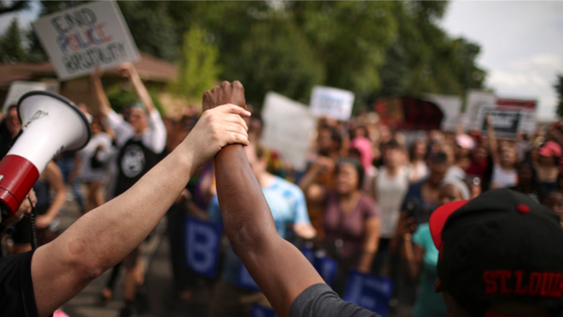 After listening to speakers in front of the St. Anthony Police Department, participants marched north on Silver Lake Rd. to 39th Ave. NE and then returned to where they started. A few hundred demonstrators protested peacefully on Silver Lake Rd. NE in front of the St. Anthony Police Department headquarters Sunday afternoon, July 10, 2016 in St. Anthony. (Jeff Wheeler/Star Tribune via AP)