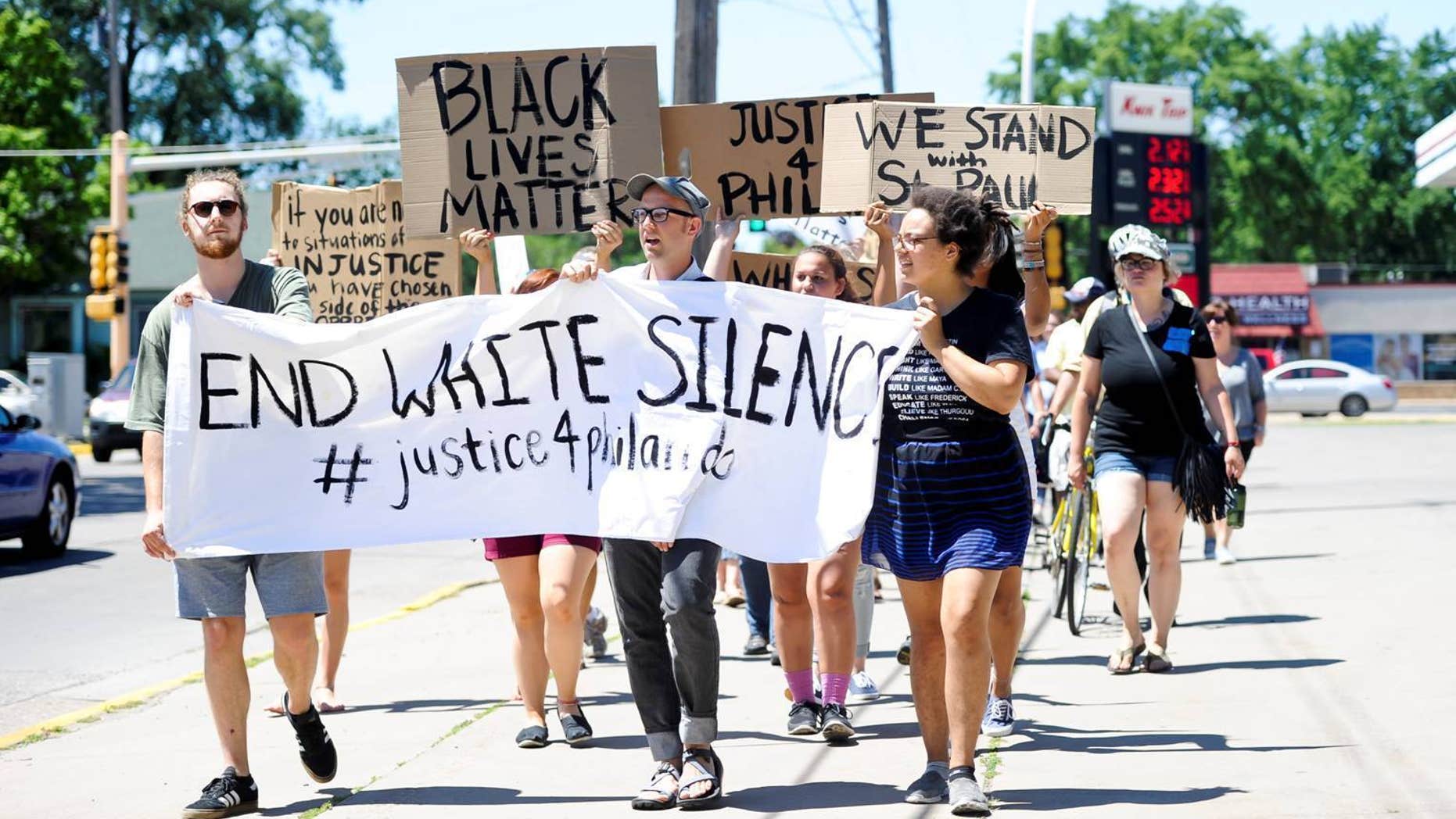 A peaceful gathering and march, Saturday, July 9, 2016, in Winona, Minn.