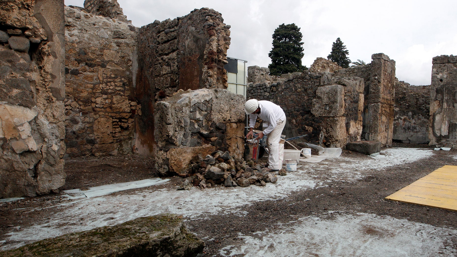 Feb. 6, 2013: A restorer works in the ancient Roman city Pompeii, which was buried in AD 79 by an eruption of the Vesuvius volcano.