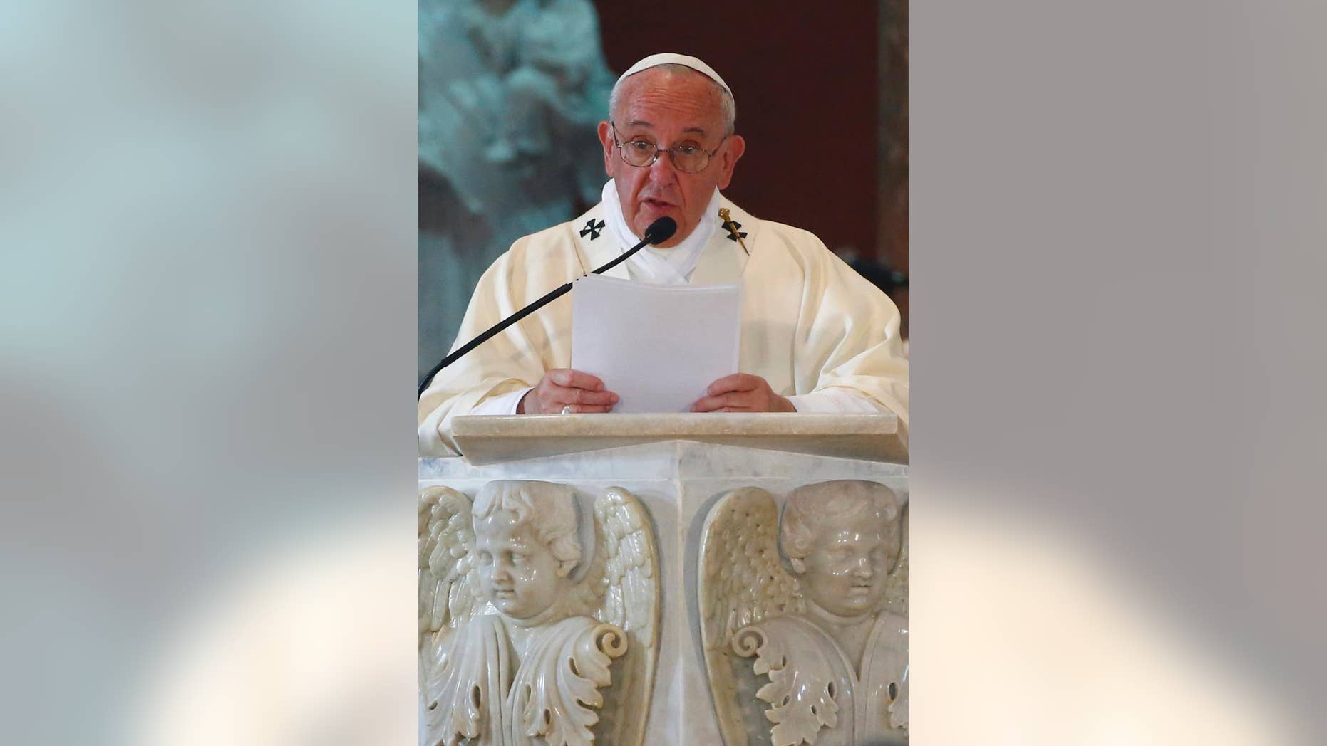 Pope Francis leads Mass in the sanctuary of the Virgin of Charity in El Cobre, Cuba, Tuesday, Sept. 22, 2015. Pope Francis on Tuesday called on Cubans to rediscover their Catholic heritage and live a "revolution of tenderness," powerful words in a country whose 1959 revolution installed an atheist, communist government that sought to replace the church as the guiding force in people's lives. (Tony Gentile/Pool via AP)