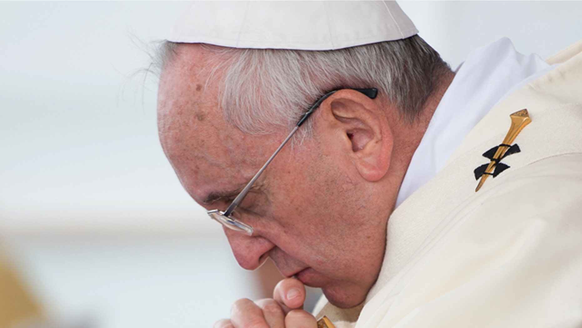 In this picture made available by the Vatican newspaper L'Osservatore Romano, Pope Francis celebrates an open-air mass at Italy's largest war memorial, in Fogliano Redipuglia, northern Italy, Saturday, Sept. 13, 2014. Pope Francis urged the world Saturday to shed its apathy in the face of what he characterizes as a third world war, intoning "war is madness" at the foot of a grandiose monument to soldiers killed in World War I. The pope's paternal grandfather fought in Italy's 1915-17 offensive against the Austro-Hungarian empire waged in the nearby battlefields, surviving to impress upon the future pope the horror of war. (AP Photo/L'Osservatore Romano, ho)