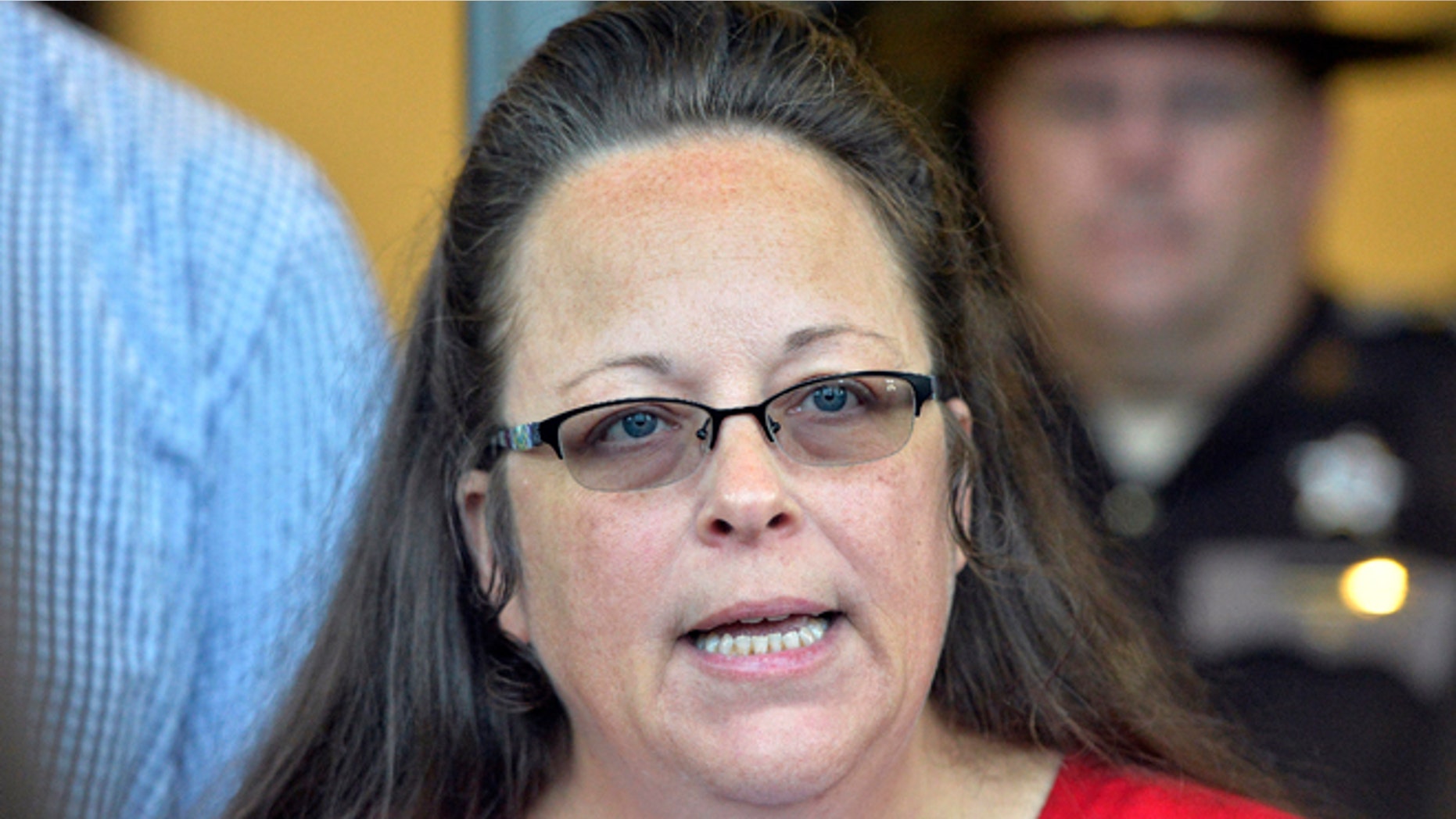 Rowan County Clerk Kim Davis makes a statement to the media at the front door of the Rowan County Judicial Center in Morehead, Kentucky. (AP Photo/Timothy D. Easley, File)