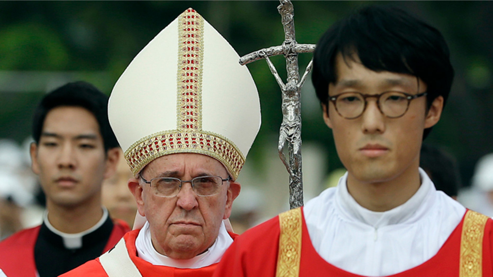 Pope Francis celebrates a mass and the beatification of Paul Yun ji-Chung and 123 martyr companions at Gwanghwamun Gate in Seoul, South Korea, Saturday, Aug. 16, 2014. Paul Yun Ji-Chung was born in 1759 and was among the earliest Catholics on the Korean peninsula. (AP Photo/Gregorio Borgia)