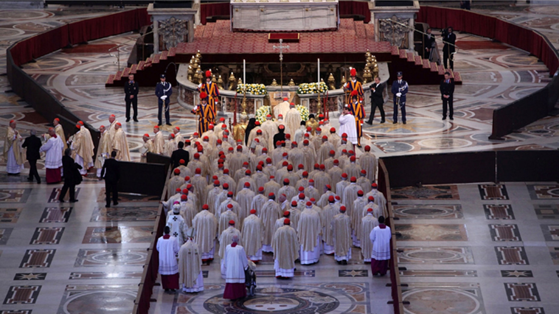 VATICAN CITY, VATICAN - MAY 01: Pope Benedict XVI and cardinals pray in front of the coffin of John Paul II at St. Peter's Basilica at the end of John Paul II Beatification Ceremony held by Pope Benedict XVI on May 1, 2011 in Vatican City, Vatican. The ceremony marking the beatification and the last stages of the process to elevate Pope John Paul II to sainthood was led by his successor Pope Benedict XI and attended by tens of thousands of pilgrims alongside heads of state and dignitaries. (Photo by Franco Origlia/Getty Images)
